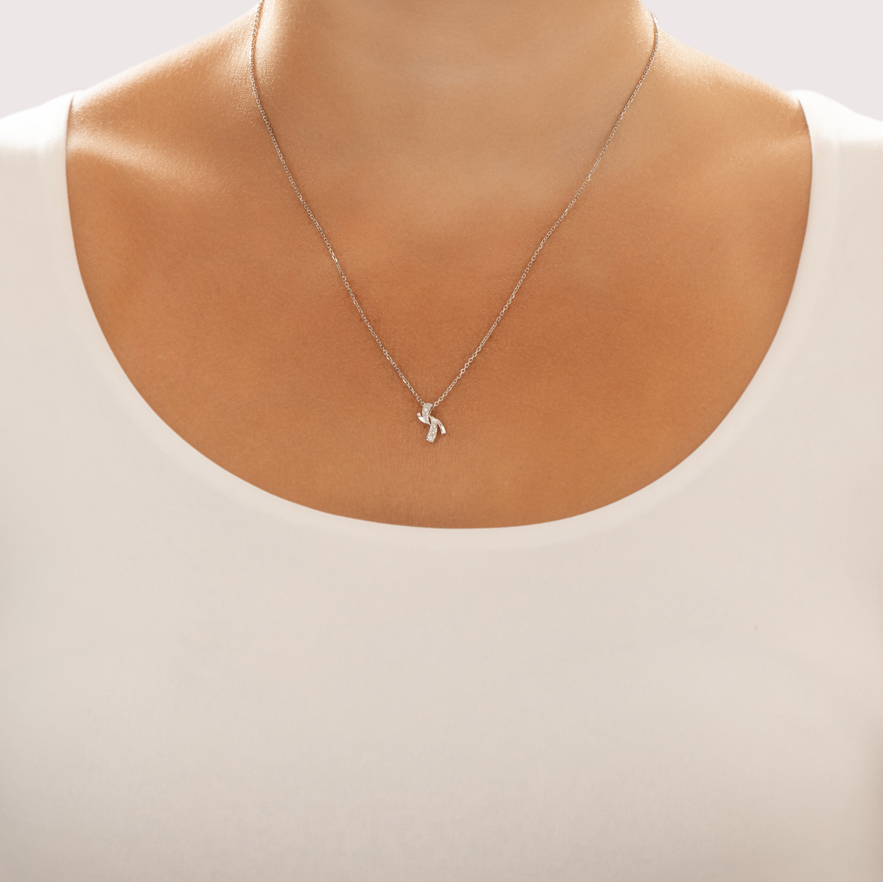 Vintage Italian Small 18k White Gold Diamond Ribbon Twirl Pendant - On model view