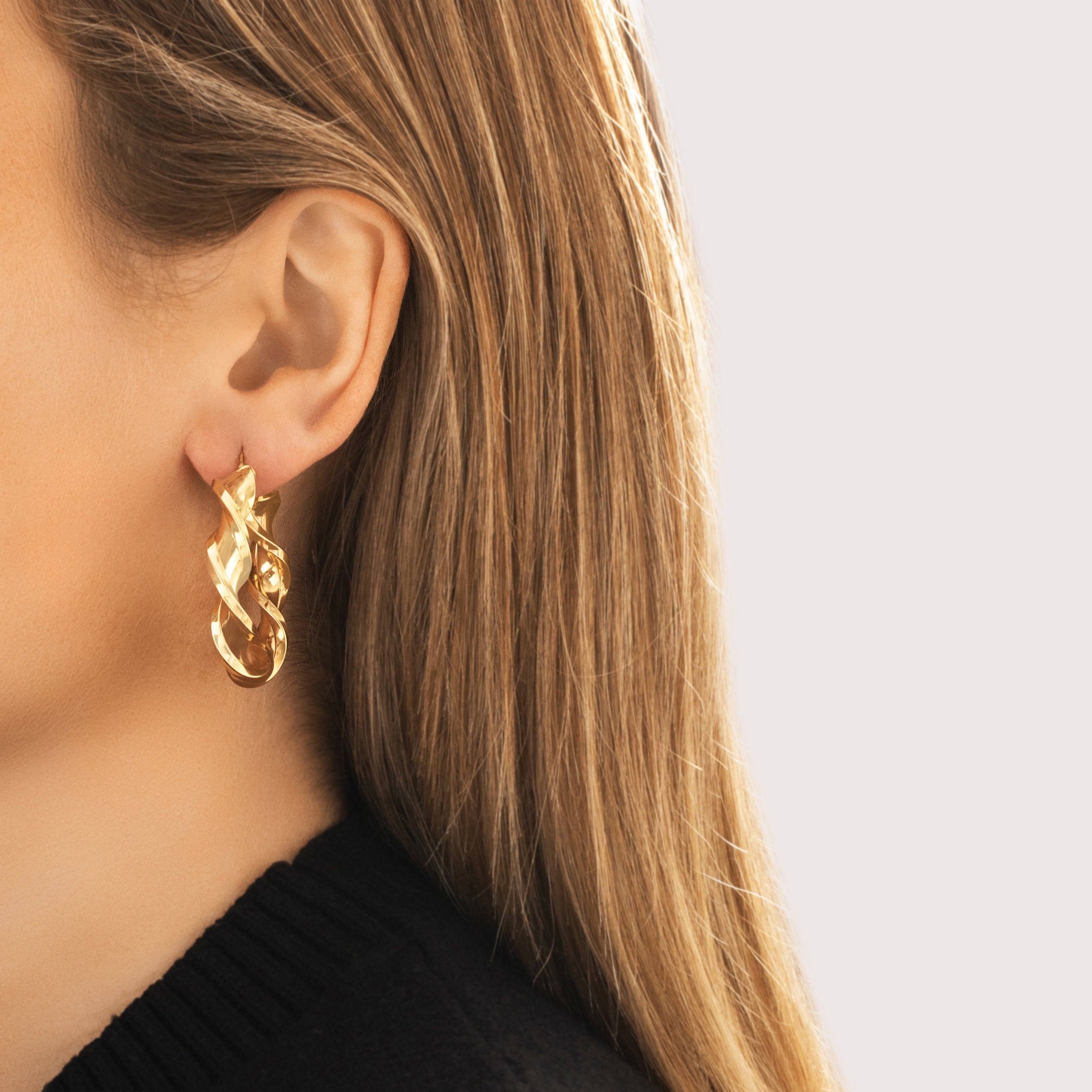 Vintage Italian Large 14k Yellow Gold Twisting Ribbon Hoop Earrings - On model view