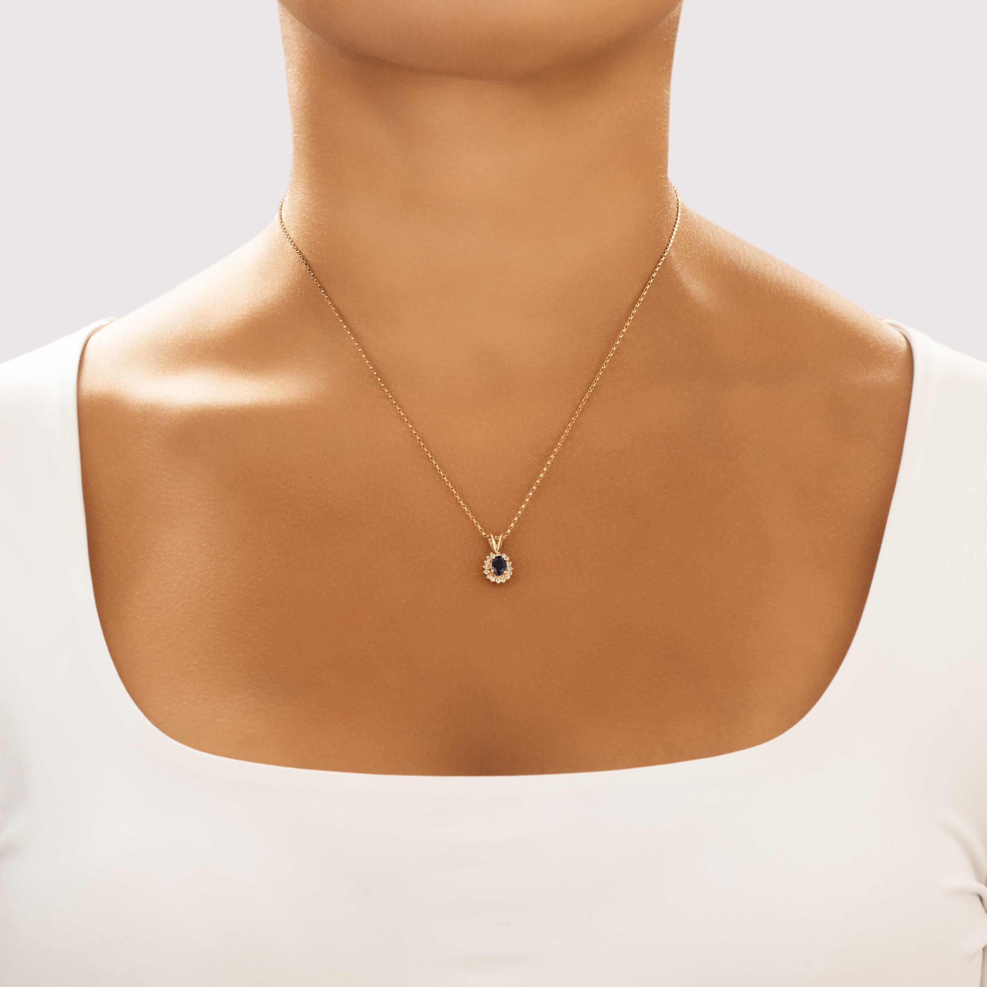 Vintage 14k Yellow Gold .53ct Blue Sapphire Diamond Classic Elegant Oval Halo Pendant - On model view