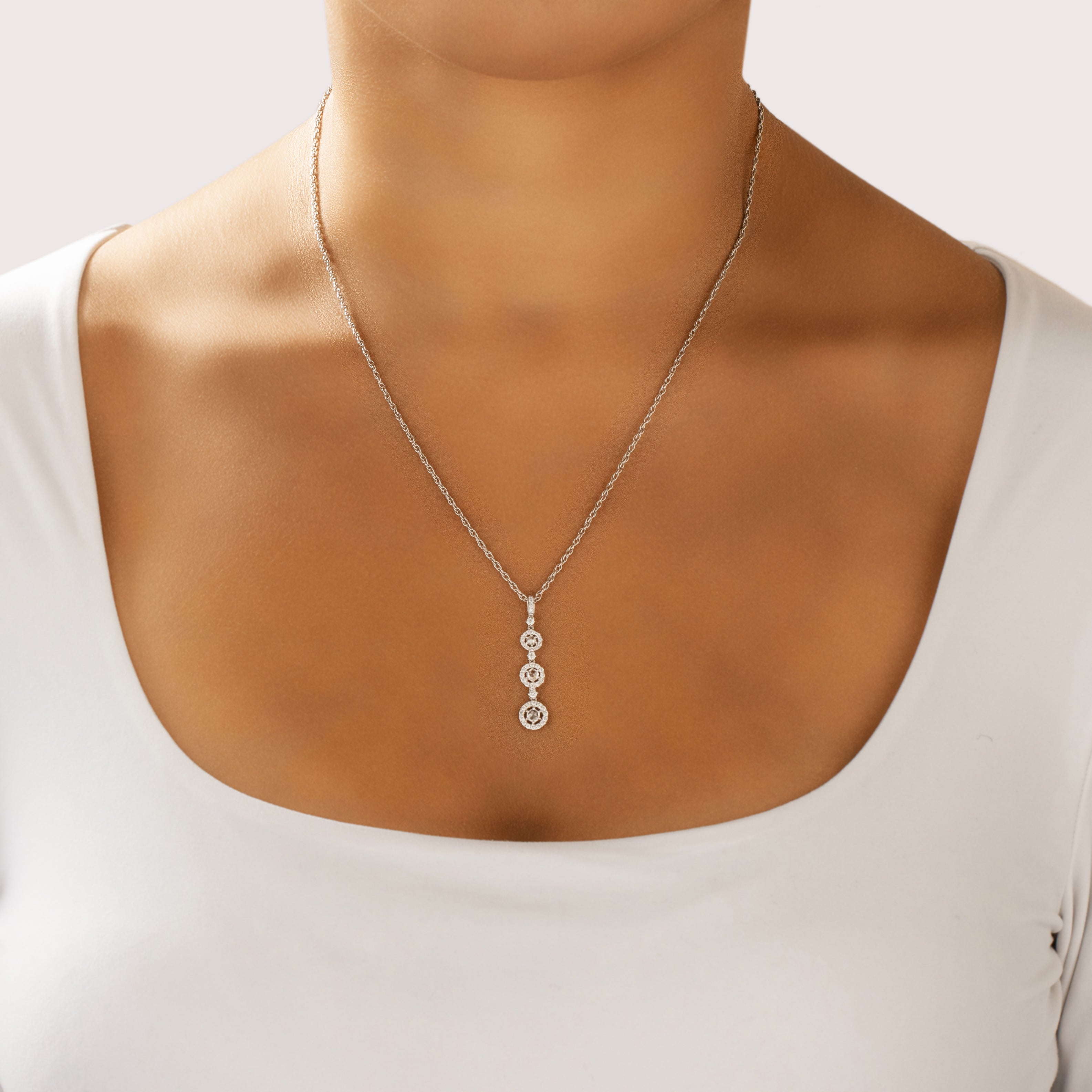 Vintage 14k White Gold Diamond Rose Cut Diamond Graduating Sparkling Halos Pendant - On model view