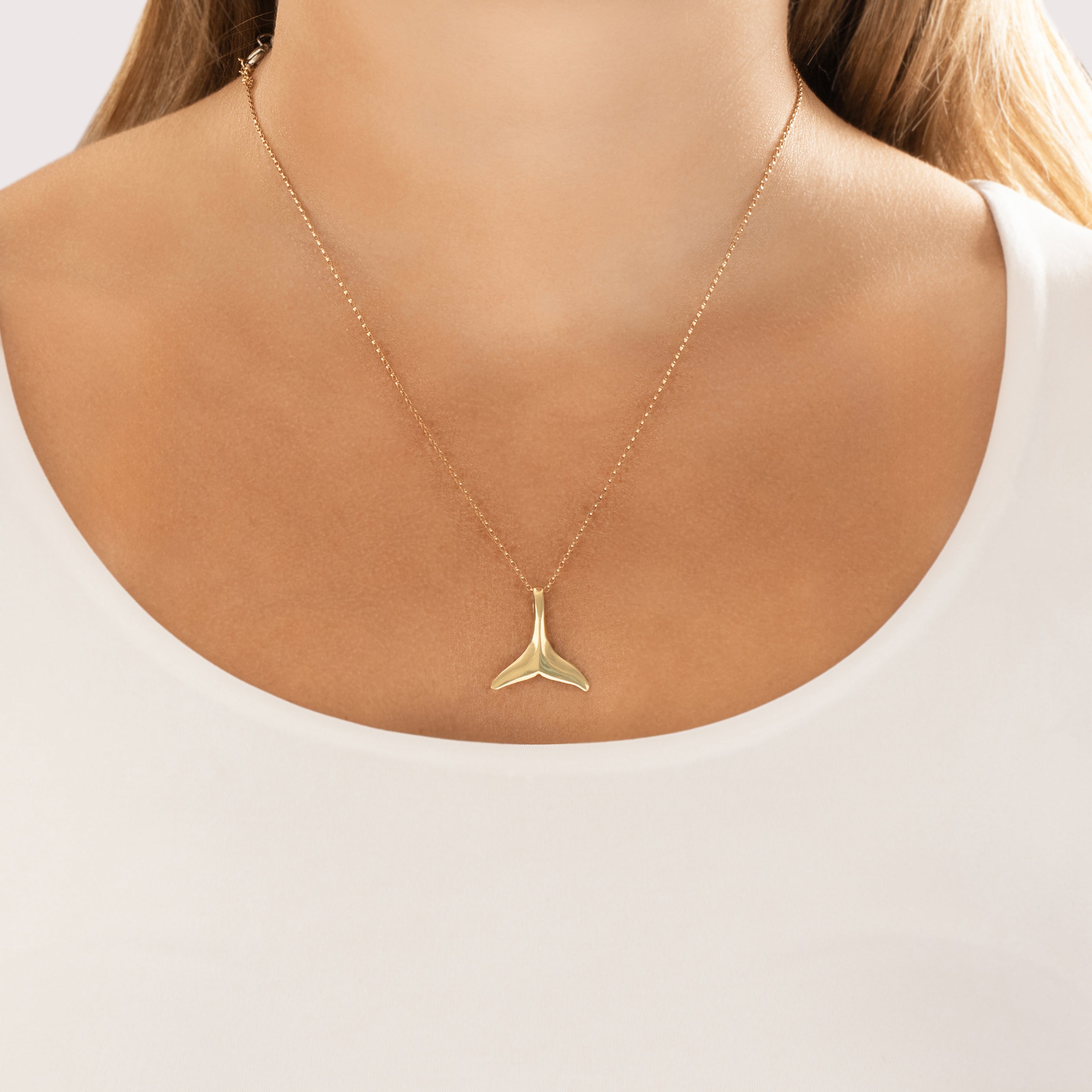 Vintage 14k Yellow Gold Gleaming Aquatic Whale Tail Pendant - On model view