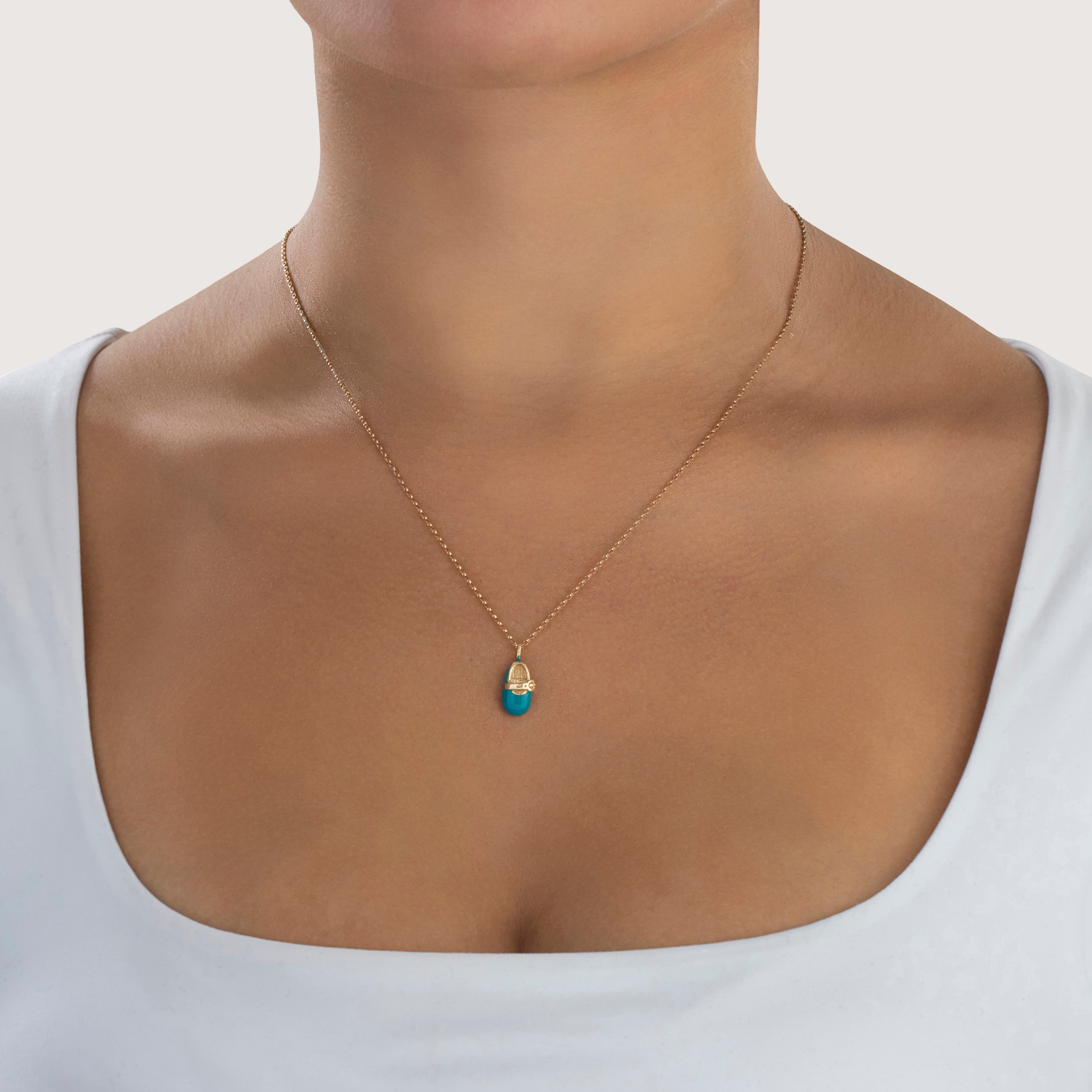 Vintage 10k Yellow Gold Teal Enamel Baby Shoe Charm / Pendant - On model view