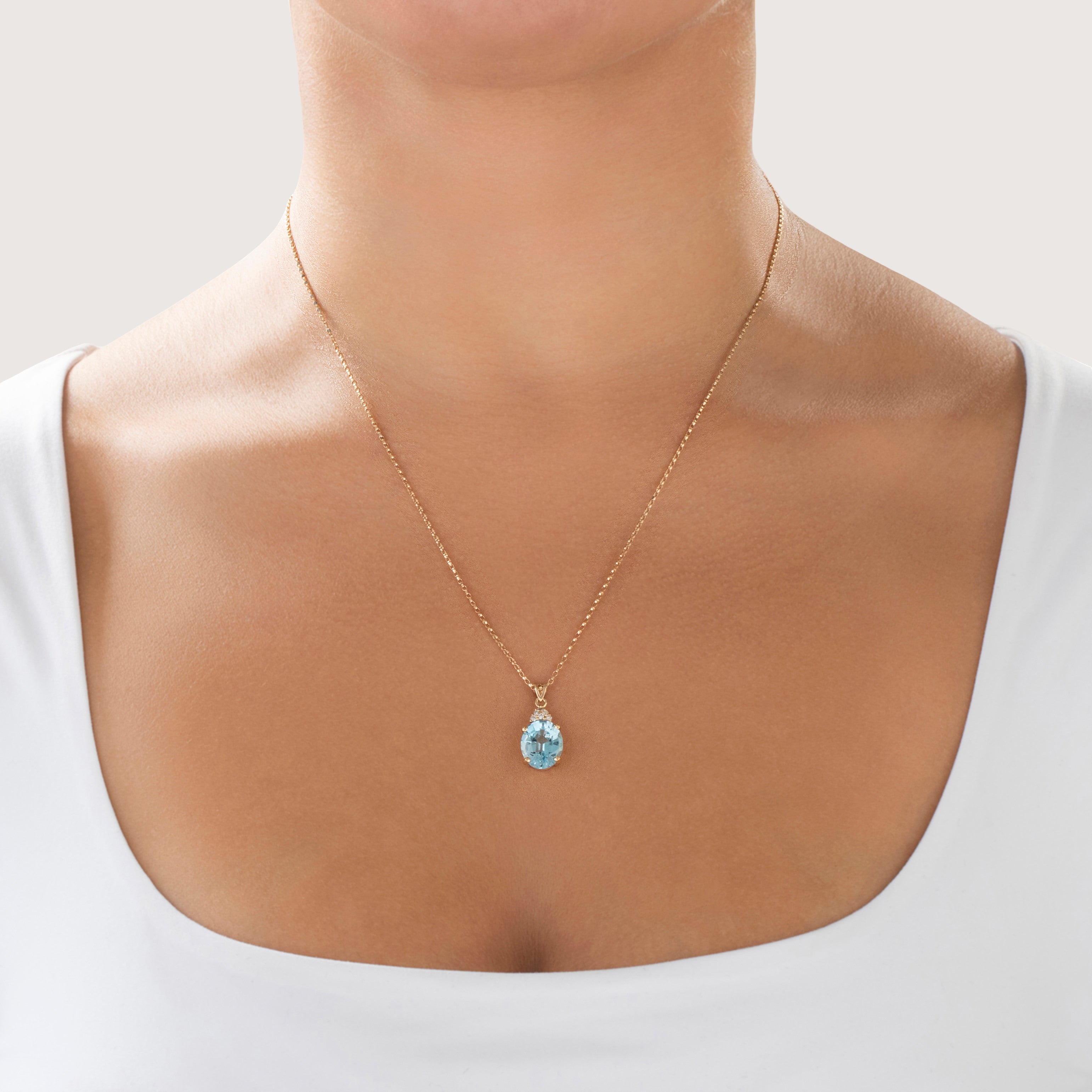 Vintage 14k Yellow Gold 5.3ct Blue Topaz Diamond Flashing Oval Pendant - On model view