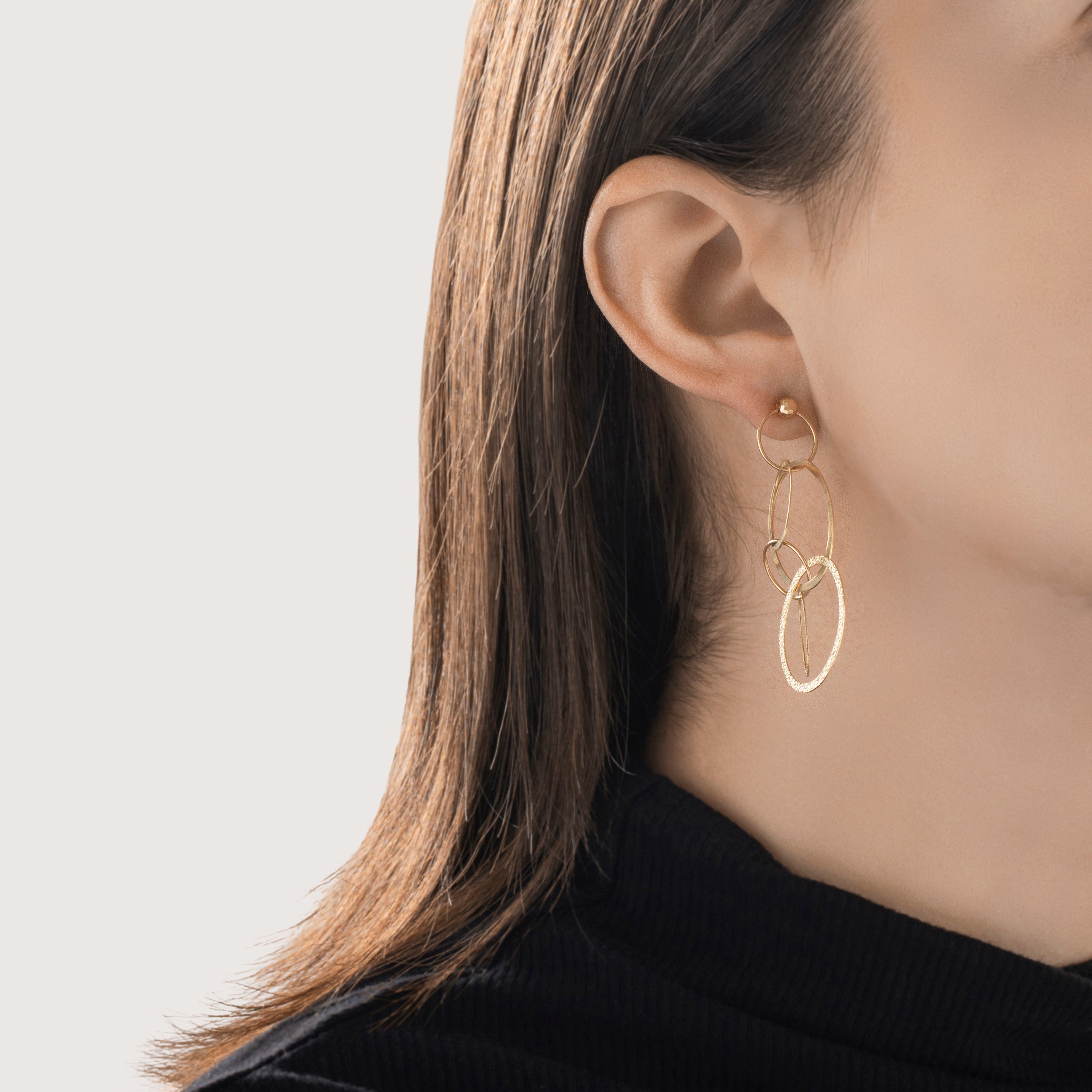 Estate Italian 14k Yellow Gold Cascading Interlocking Oval Dangle Earrings - On model view