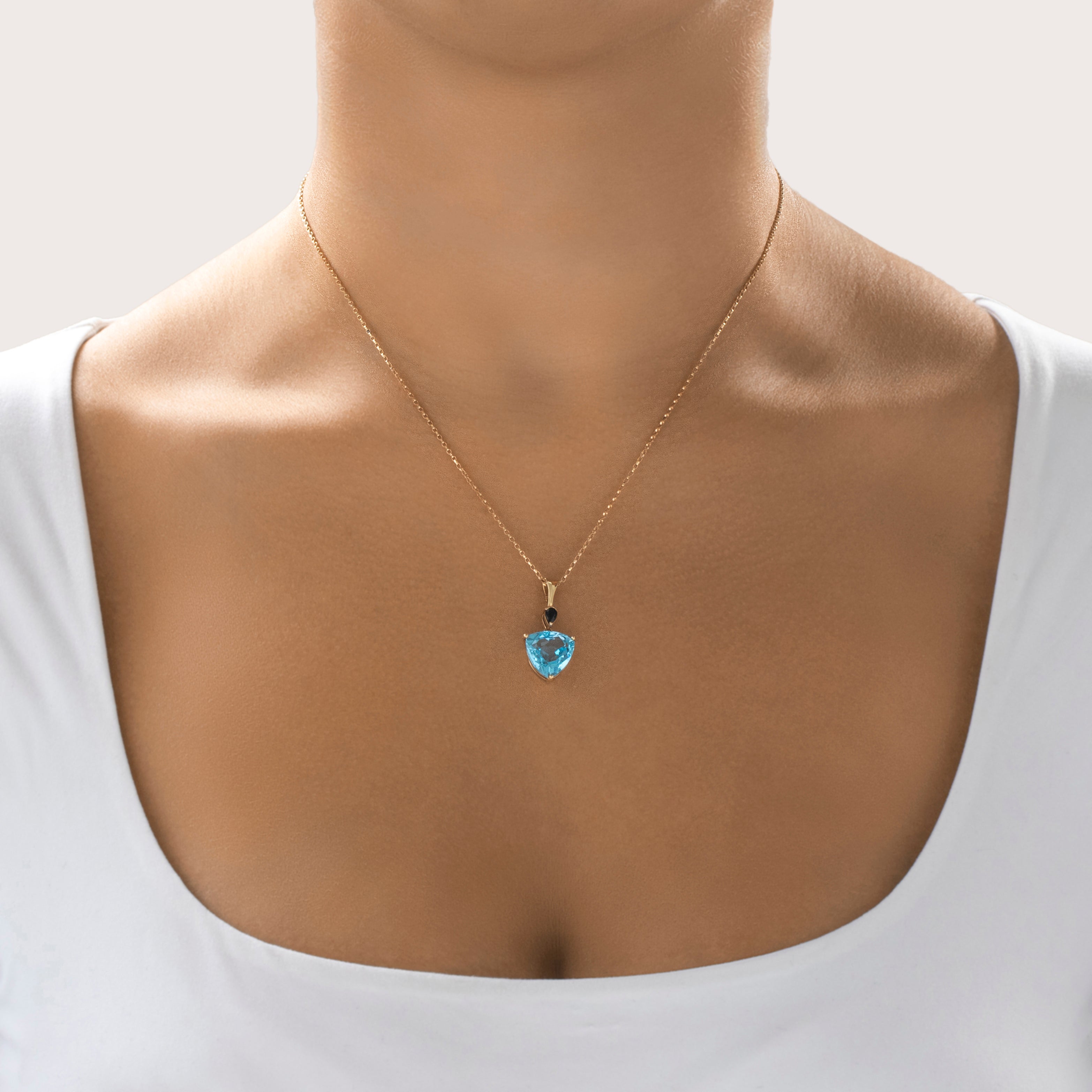 Vintage 14k Yellow Gold Blue Topaz Dark Blue Sapphire Bright Trilliant Pendant - On model view