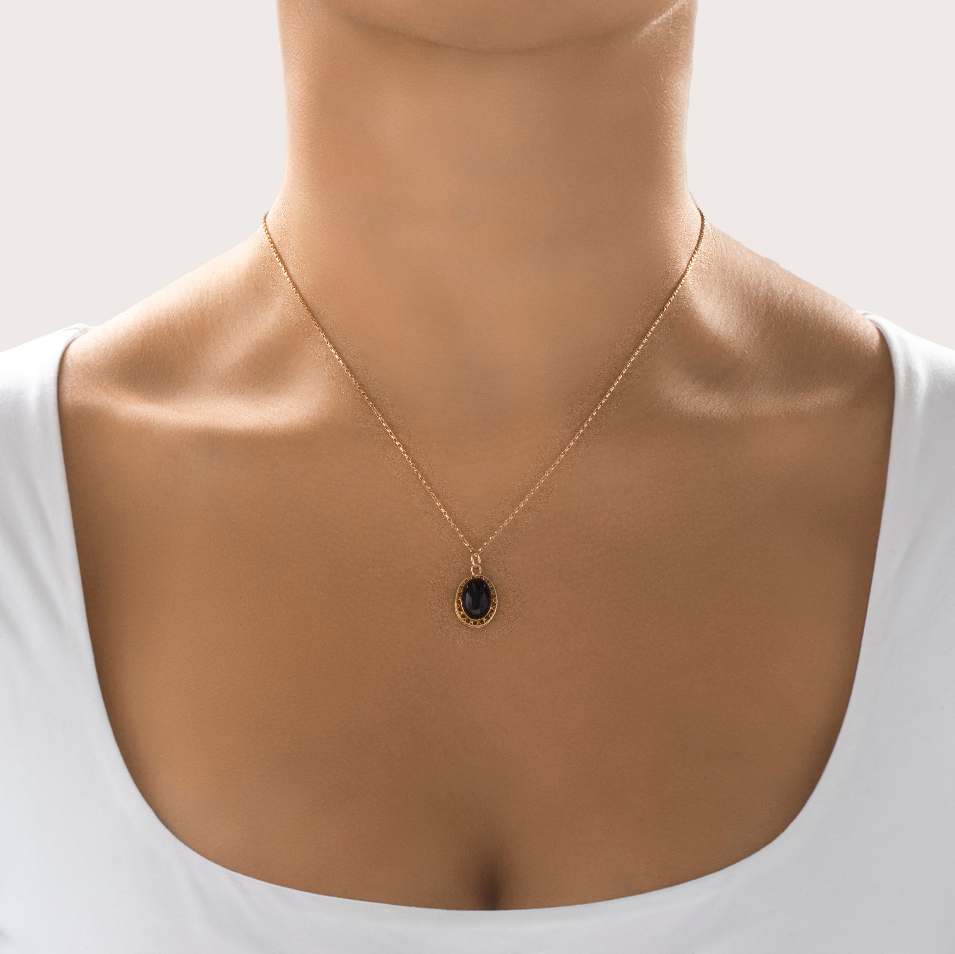 Antique 14k Yellow Gold Maroon Glass Wavy Border Cabochon Charm / Pendant - On model view