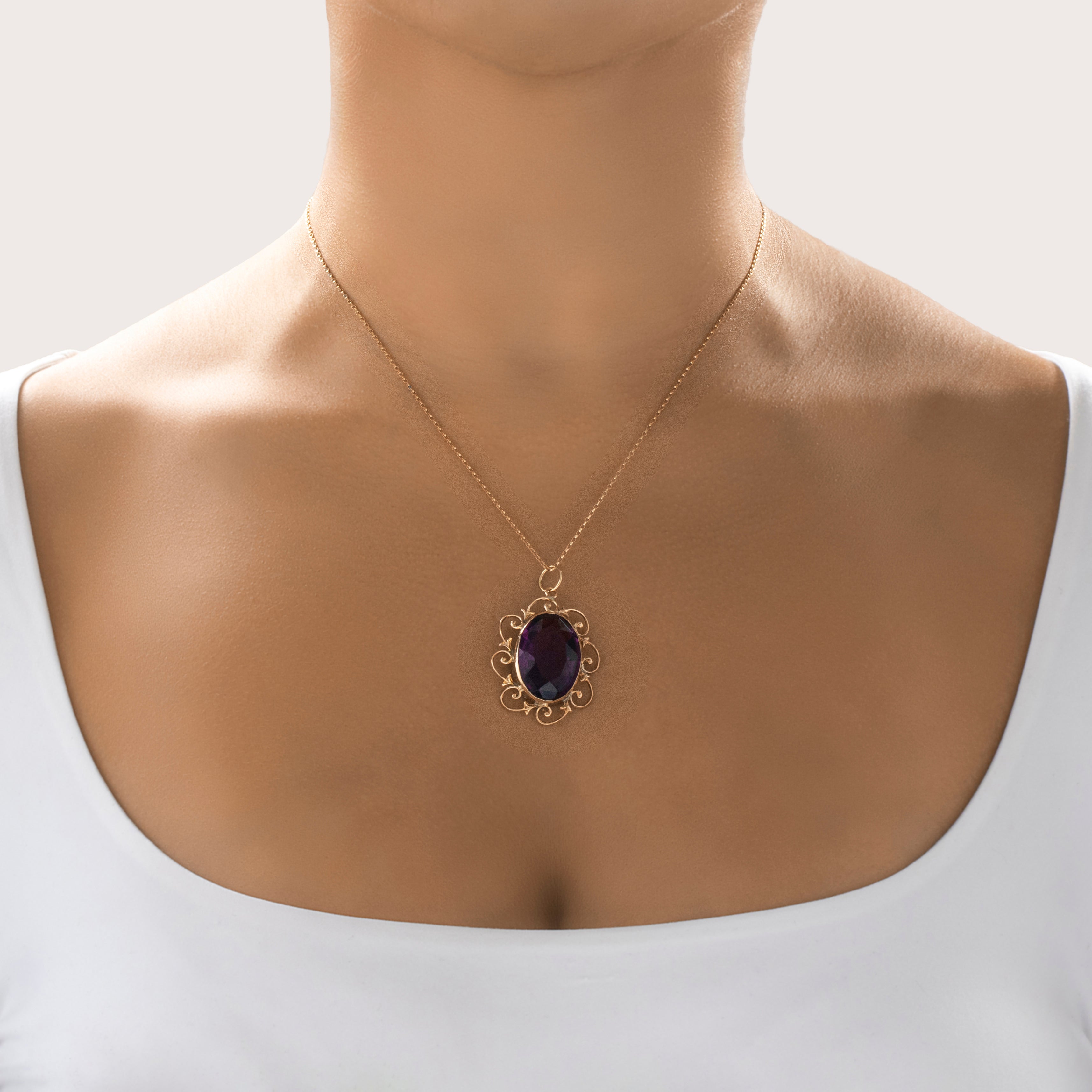 Antique Large 10k Yellow Gold Purple Glass Scrolling Flourish Border Pendant - On model view