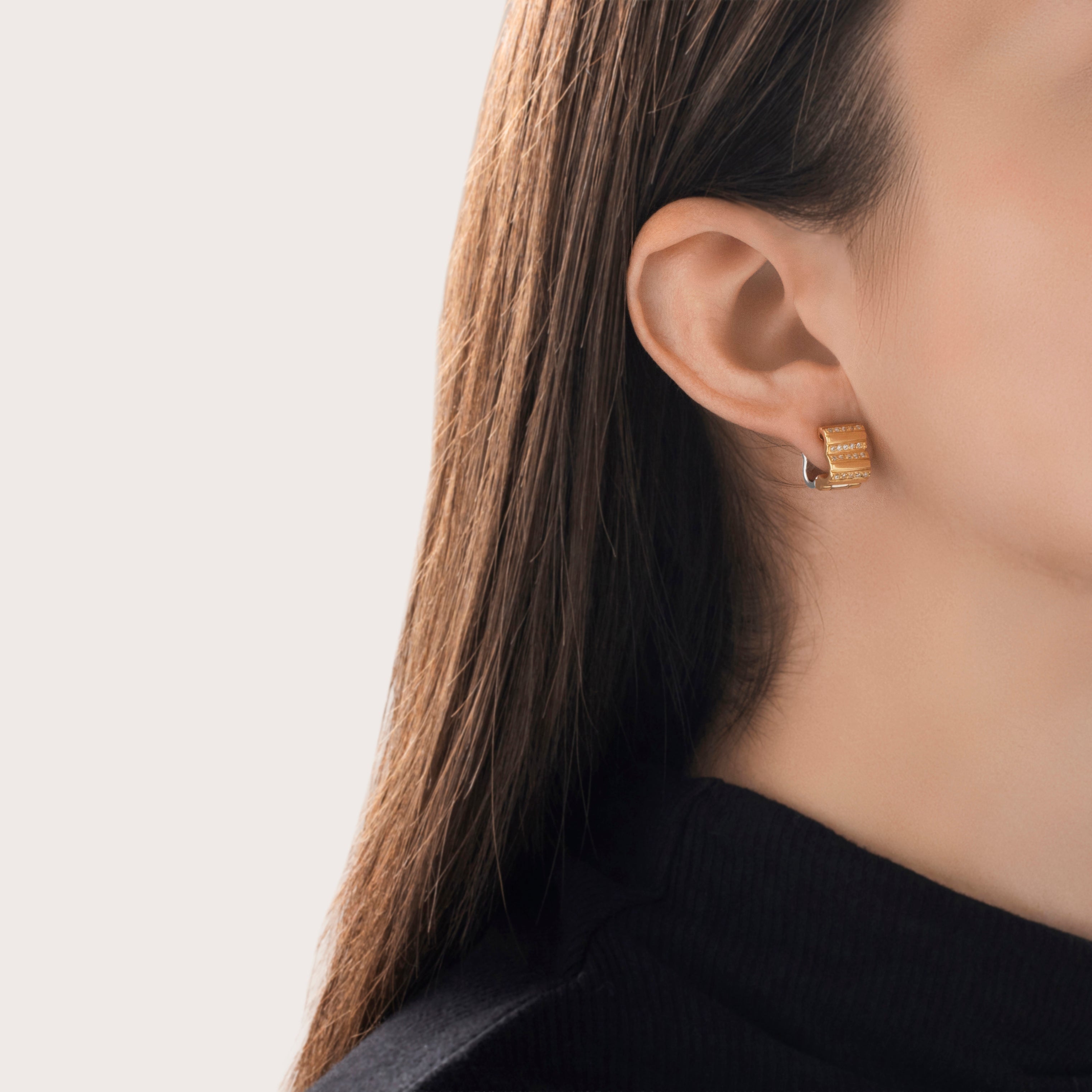 Vintage 18k Yellow & White Gold .2cttw Diamond Lined Quatrefoil Huggie Earrings - On model view