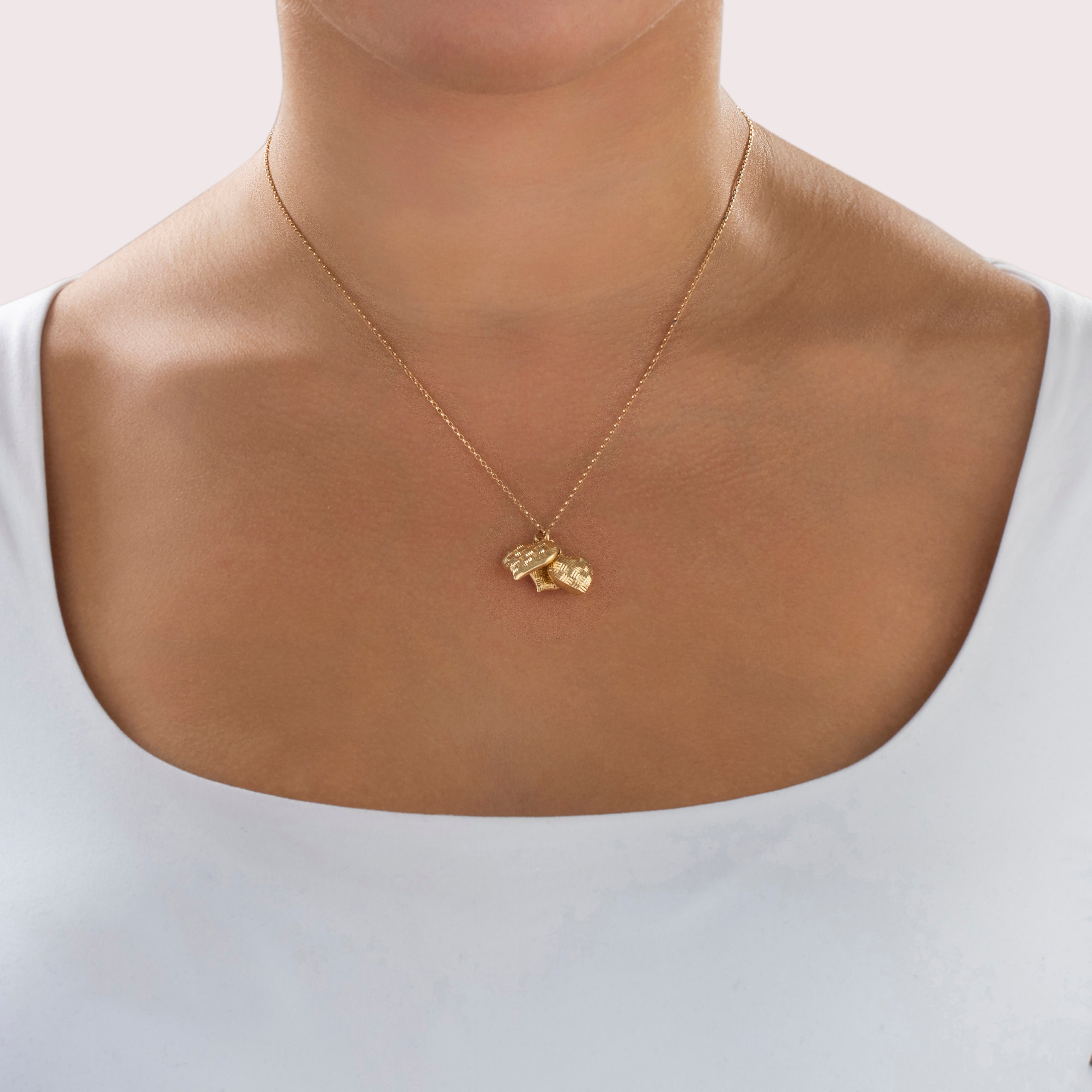 Vintage 14k Yellow Gold Fanciful Basket Weave Heart Trio Charm / Pendant - On model view