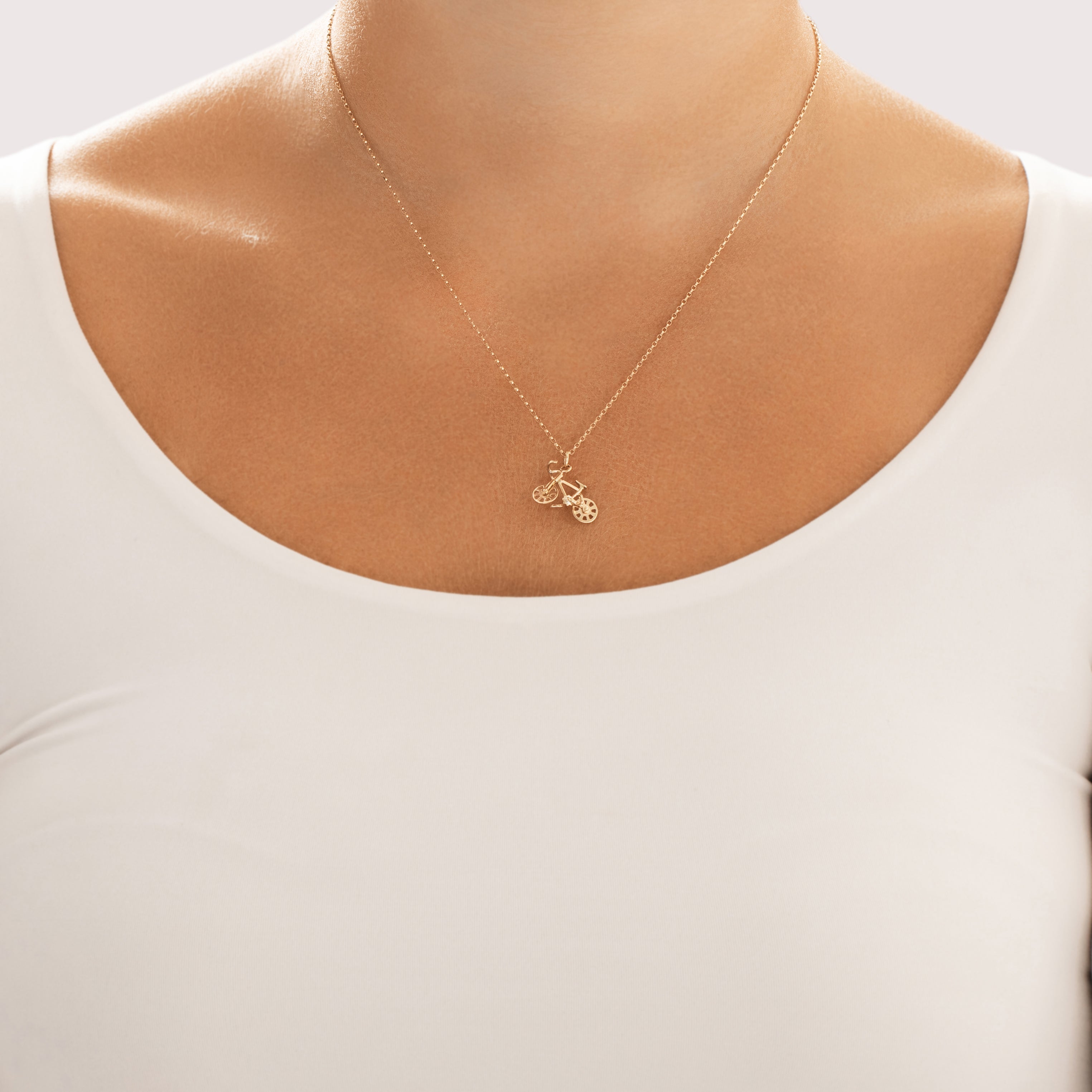 Vintage 14k Yellow Gold Speedy Pedaling Bicycle Charm / Pendant - On model view