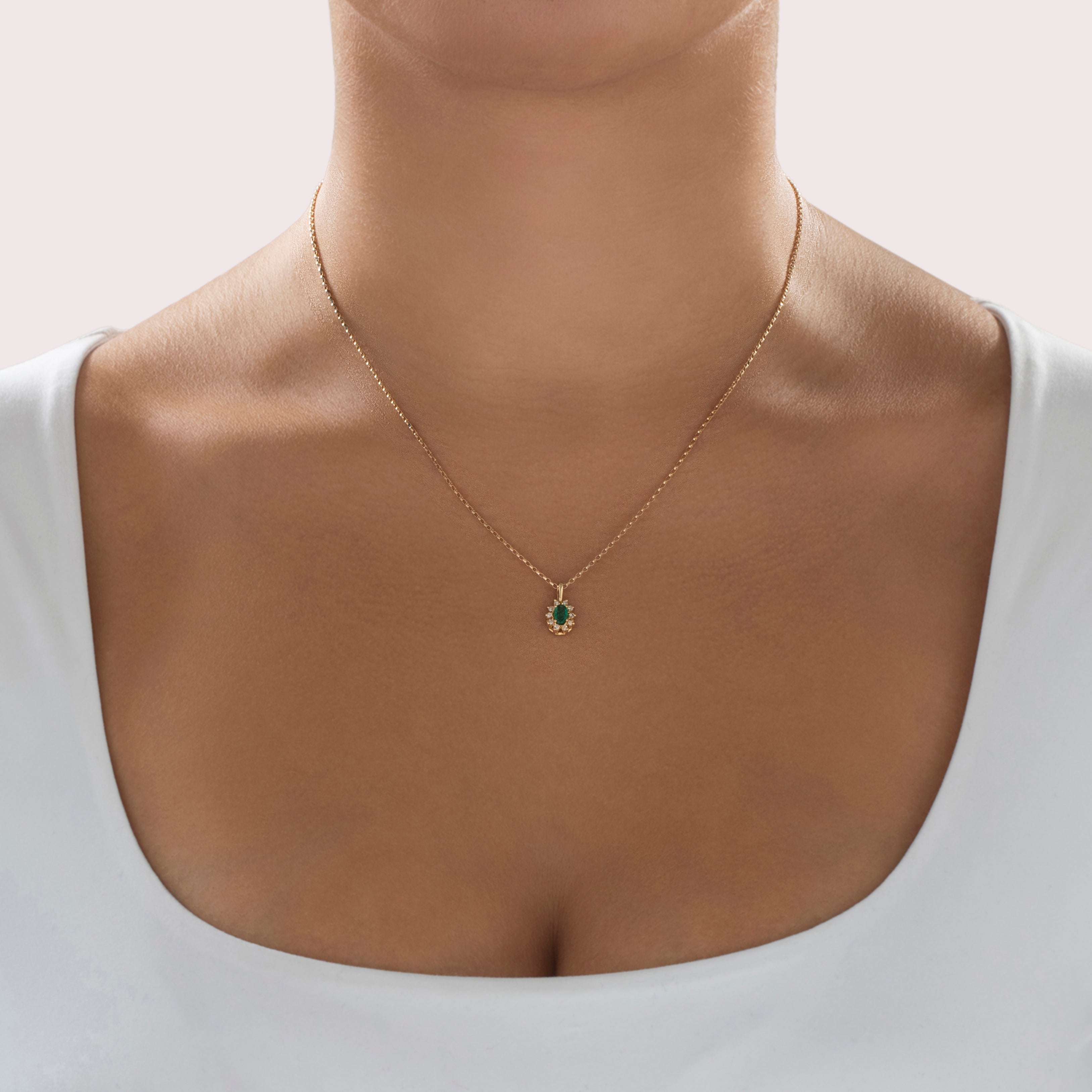 Vintage Small 14k Yellow Gold Emerald Diamond Pretty Oval Halo Pendant - On model view