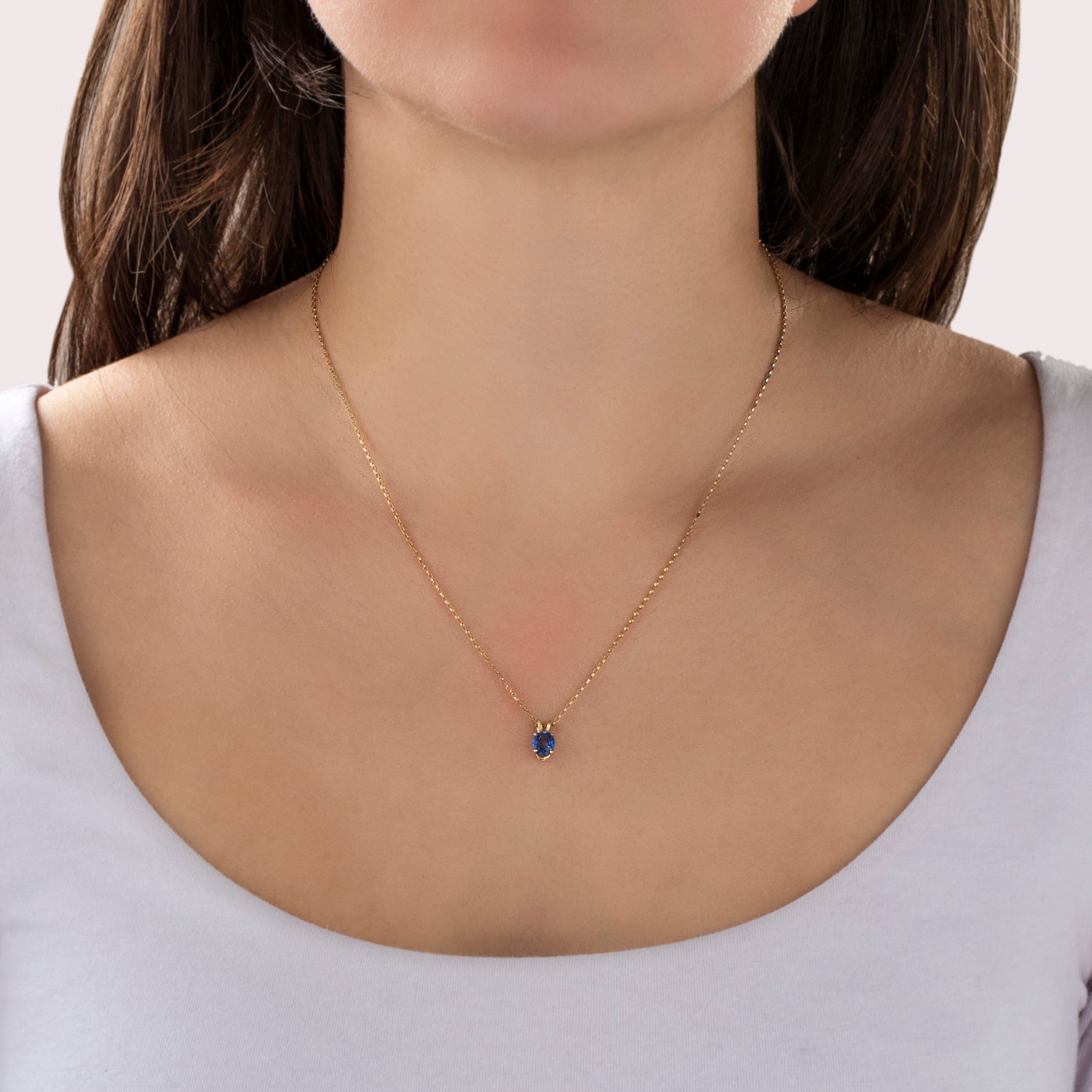 Vintage Small 14k Yellow Gold Blue Sapphire Bright Oval Pool Pendant - On model view