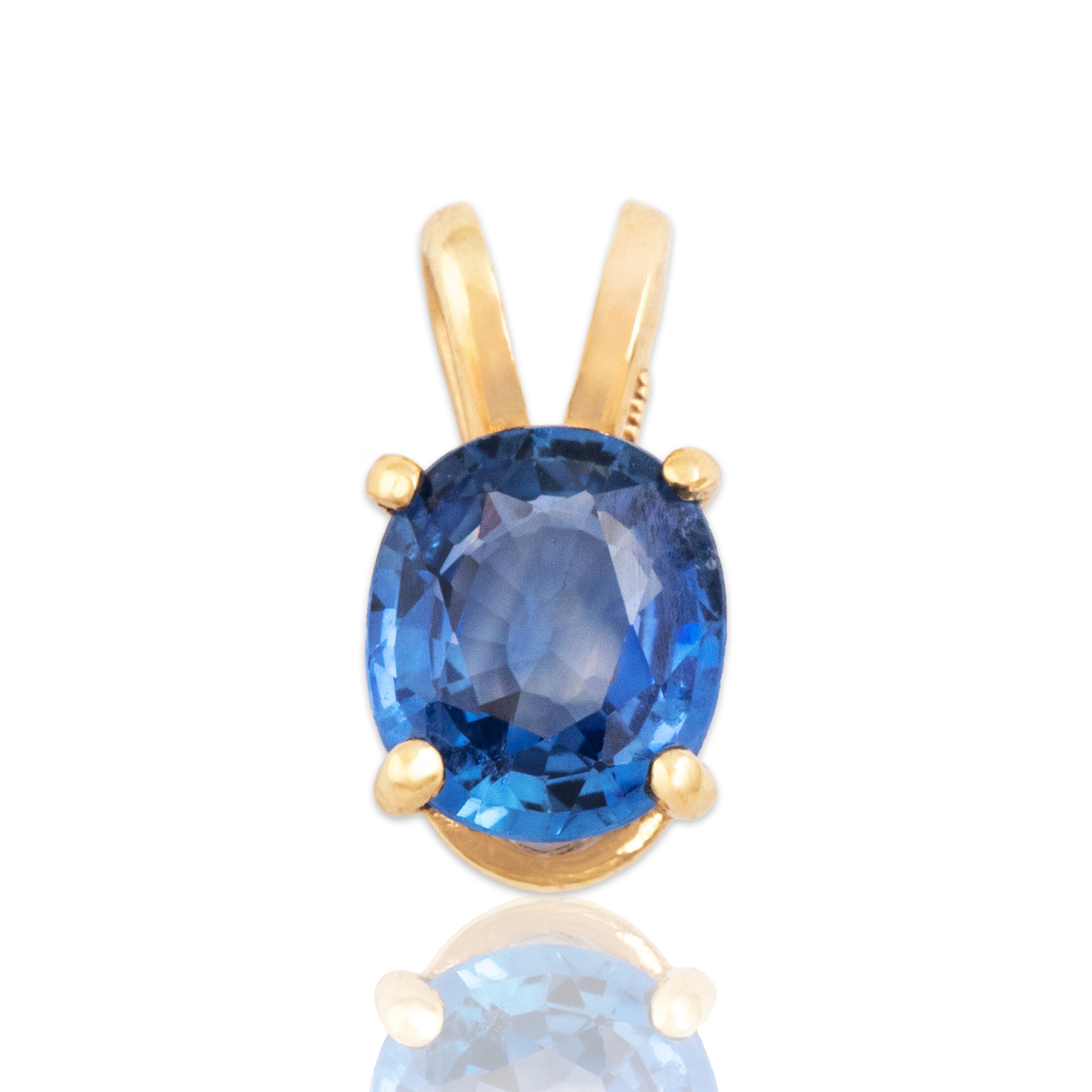 Vintage Small 14k Yellow Gold Blue Sapphire Bright Oval Pool Pendant - Close-up view