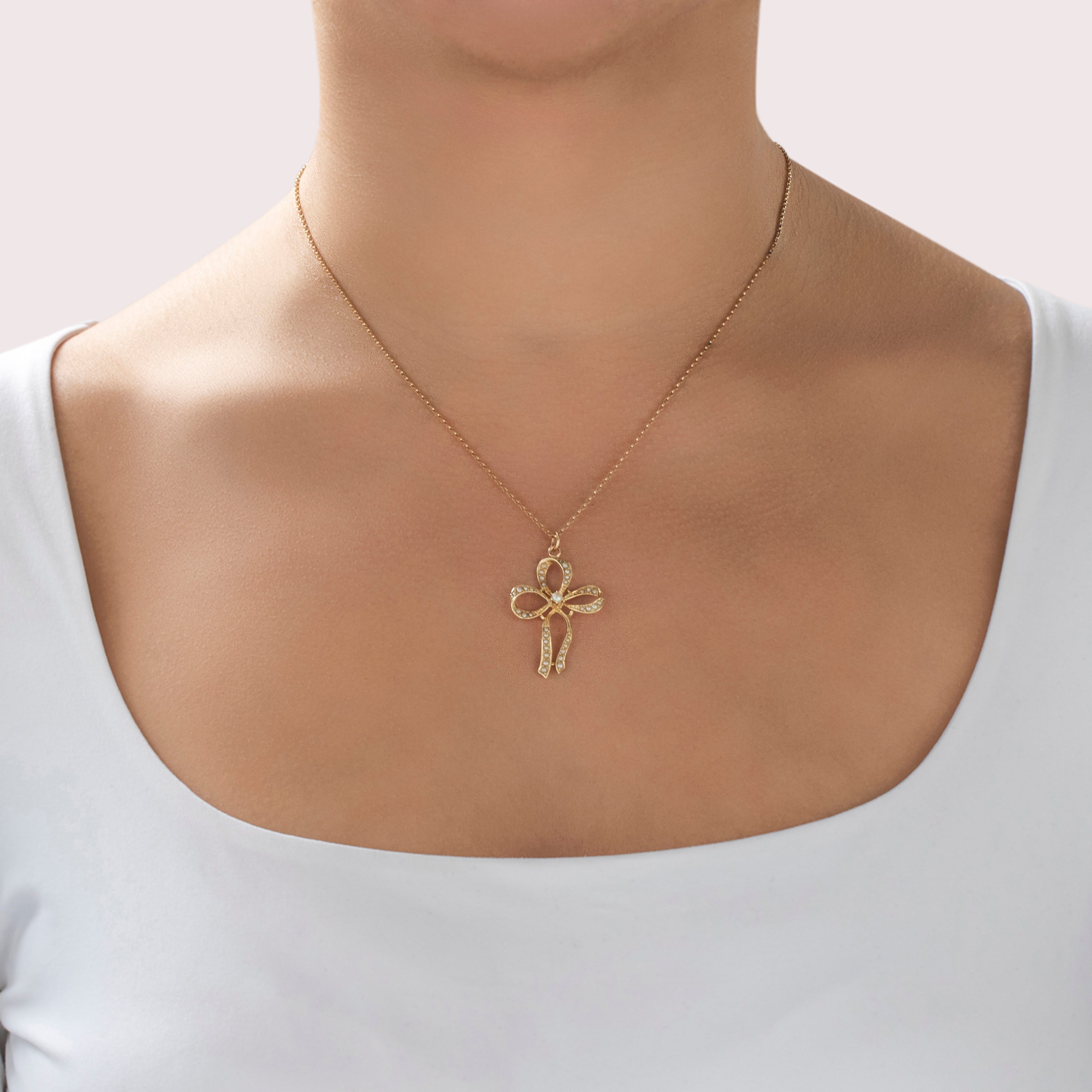 Antique Large 14k Yellow Gold Pearl Graceful Decorated Bow Pendant - On model view