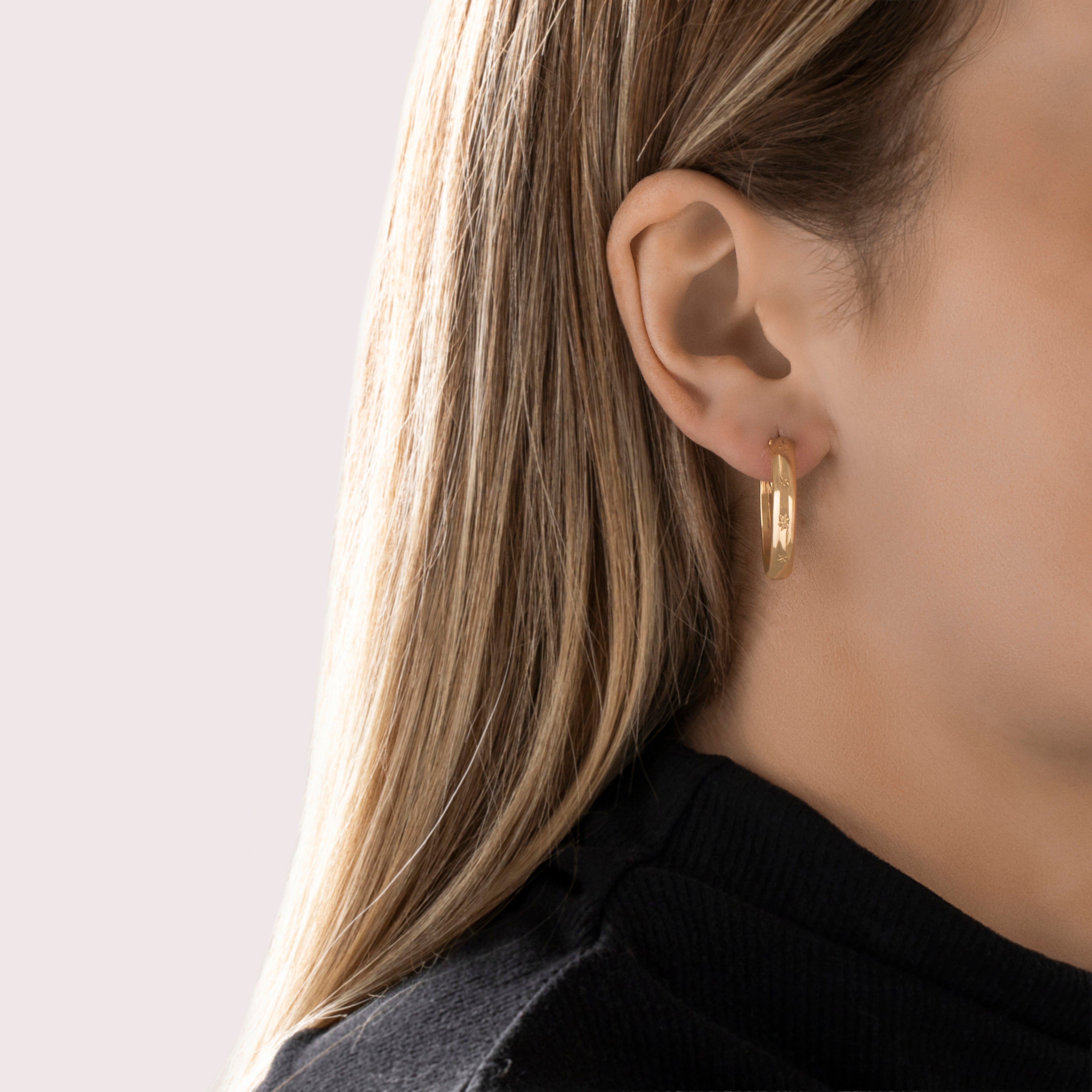 Vintage 18k Yellow Gold Star Flower Print Hoop Earrings - On model view