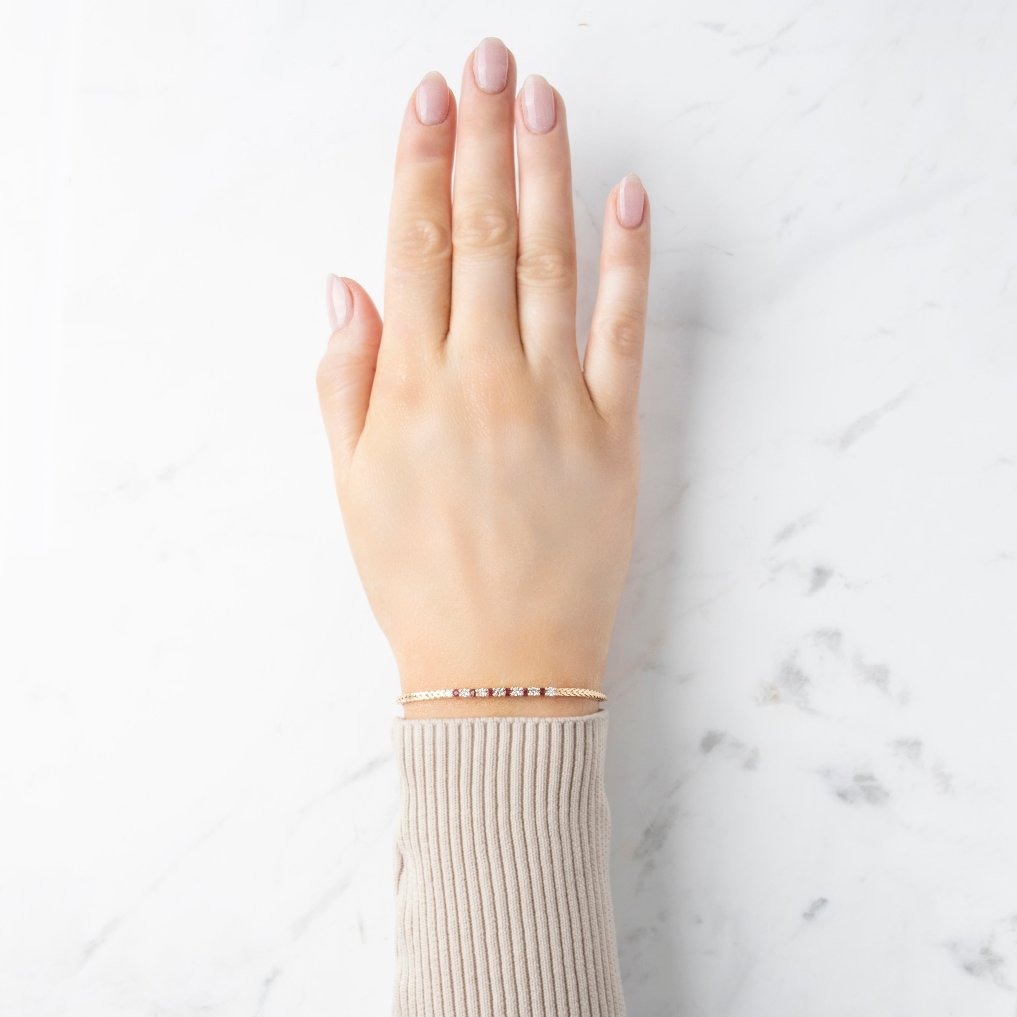 Vintage 14k Yellow Gold Diamond and Ruby Herringbone Bracelet - On model view