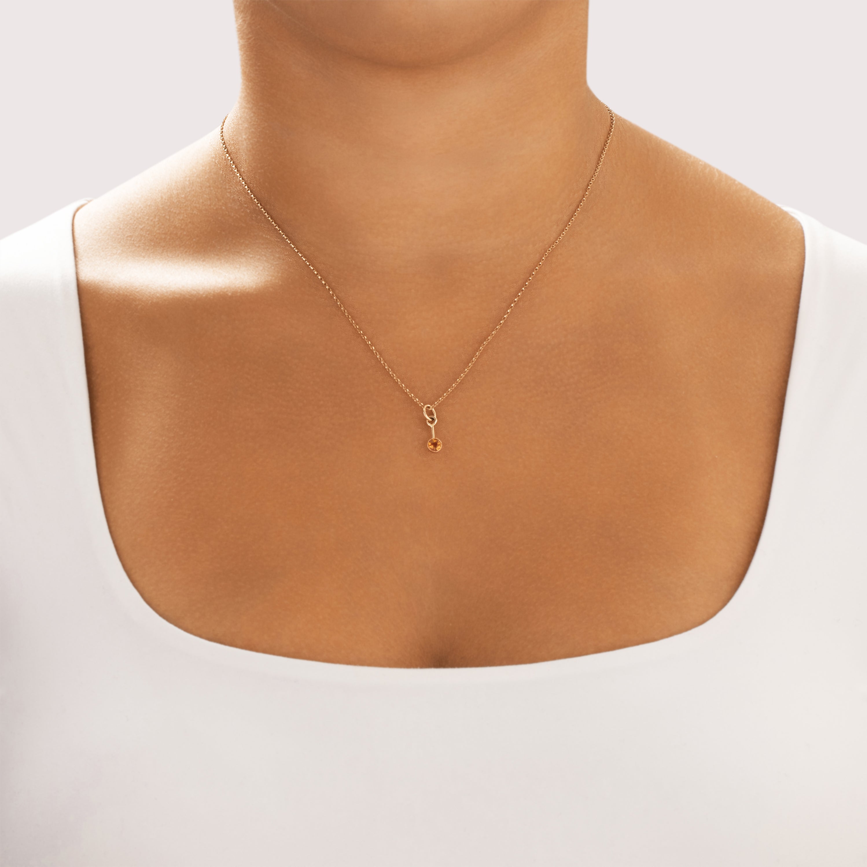 Antique Small 14k Rosy Yellow Gold Citrine Dainty Bezel Dangle Charm / Pendant - On model view