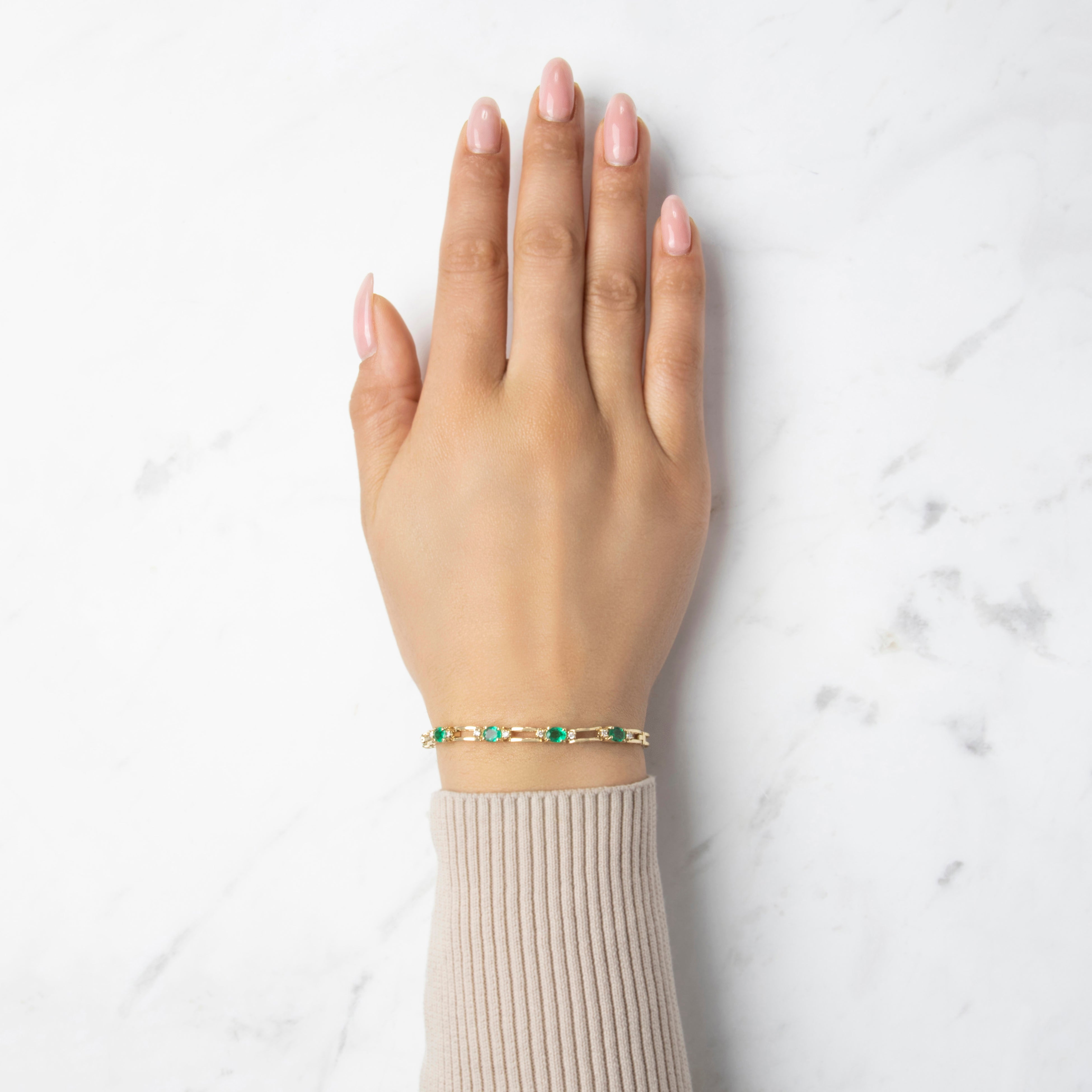 Vintage 14k Yellow Gold Emerald Diamond Oval Trio Station Bracelet - On model view