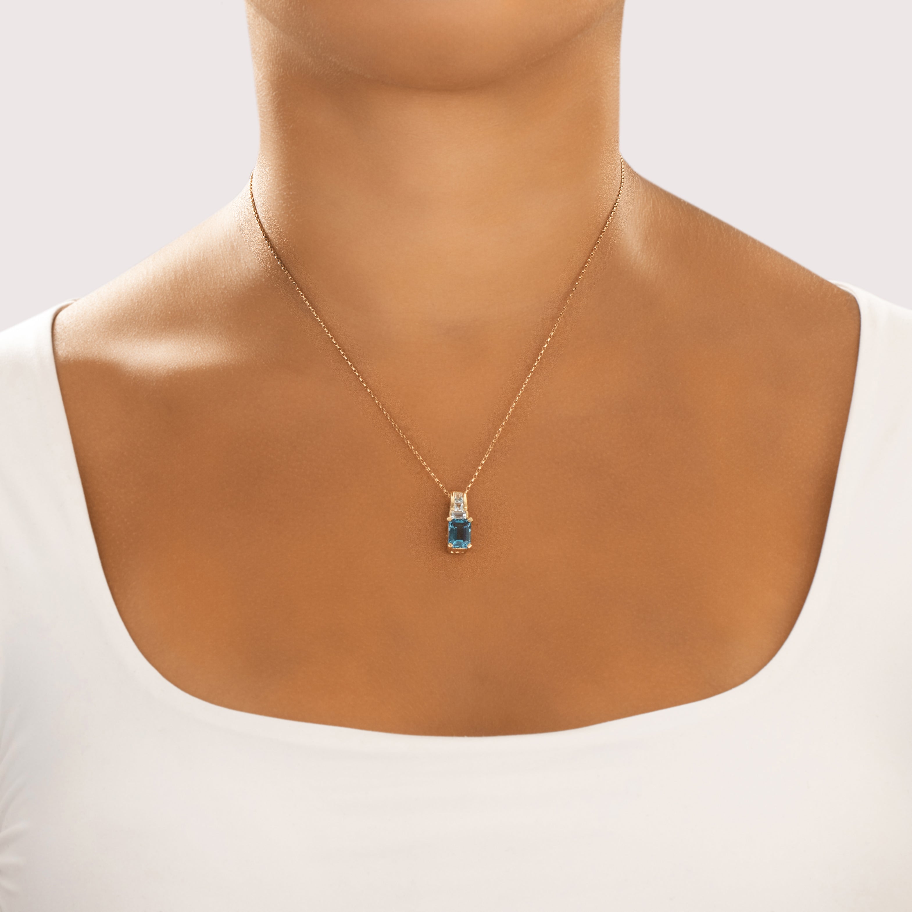 Vintage 14k Yellow Gold 3.2cttw Light Blue Topaz Elegant Rectangular Swirled Stack Pendant - On model view