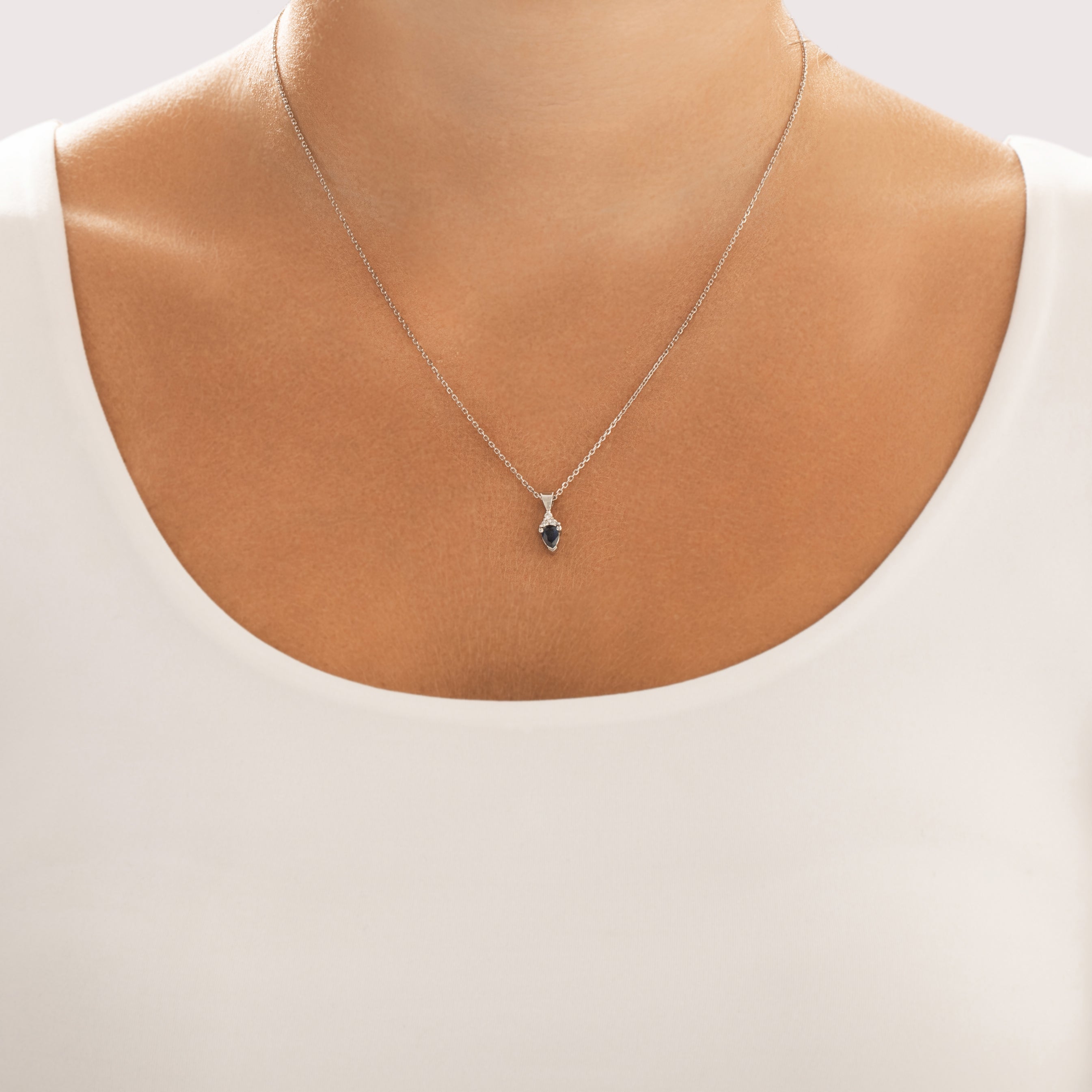 Vintage 14k White Gold Blue Sapphire Diamond Accented Inverted Pear Pendant - On model view
