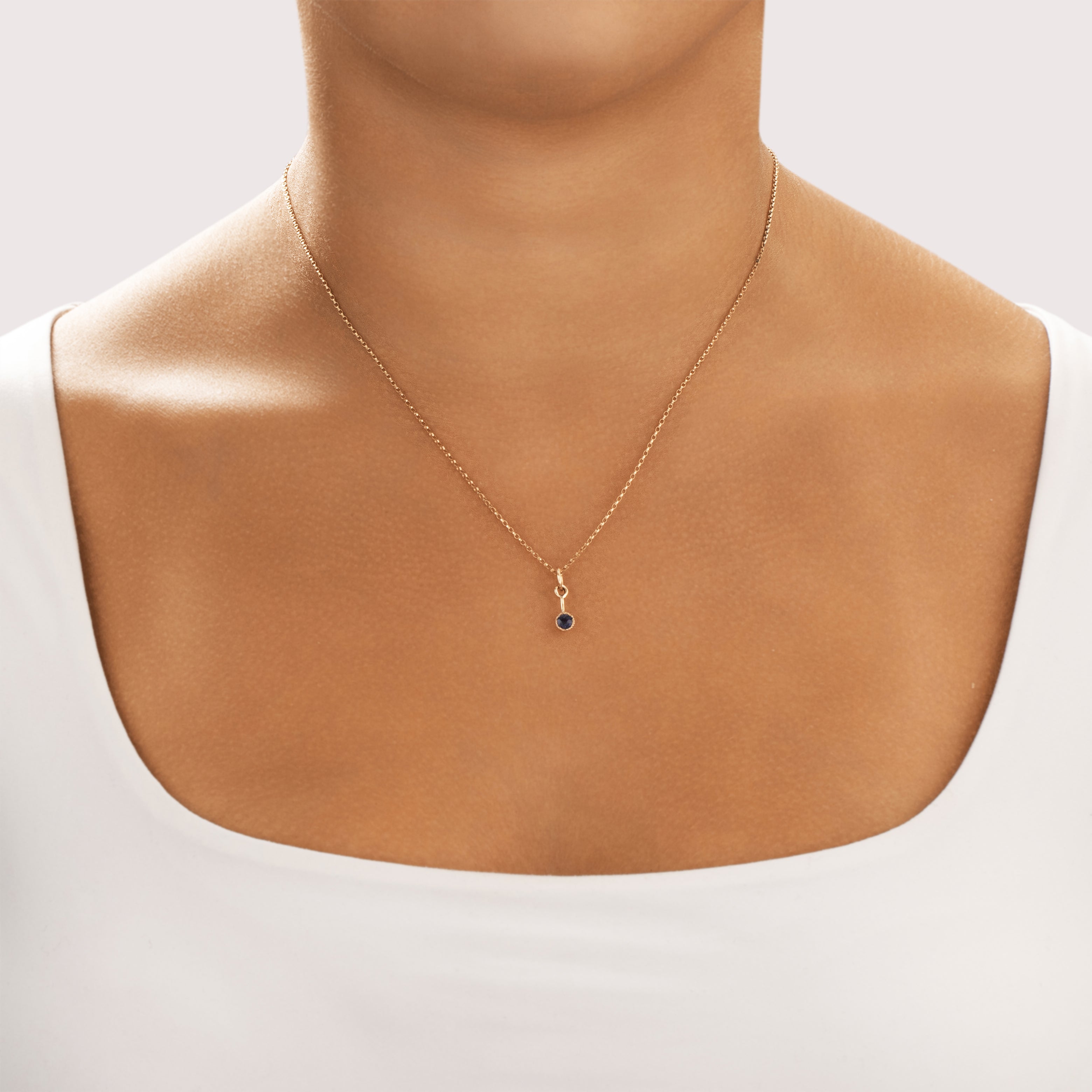 Antique 14k Yellow & Rosy Yellow Gold Blue Sapphire Dainty Drop Dangle Charm / Pendant - On model view