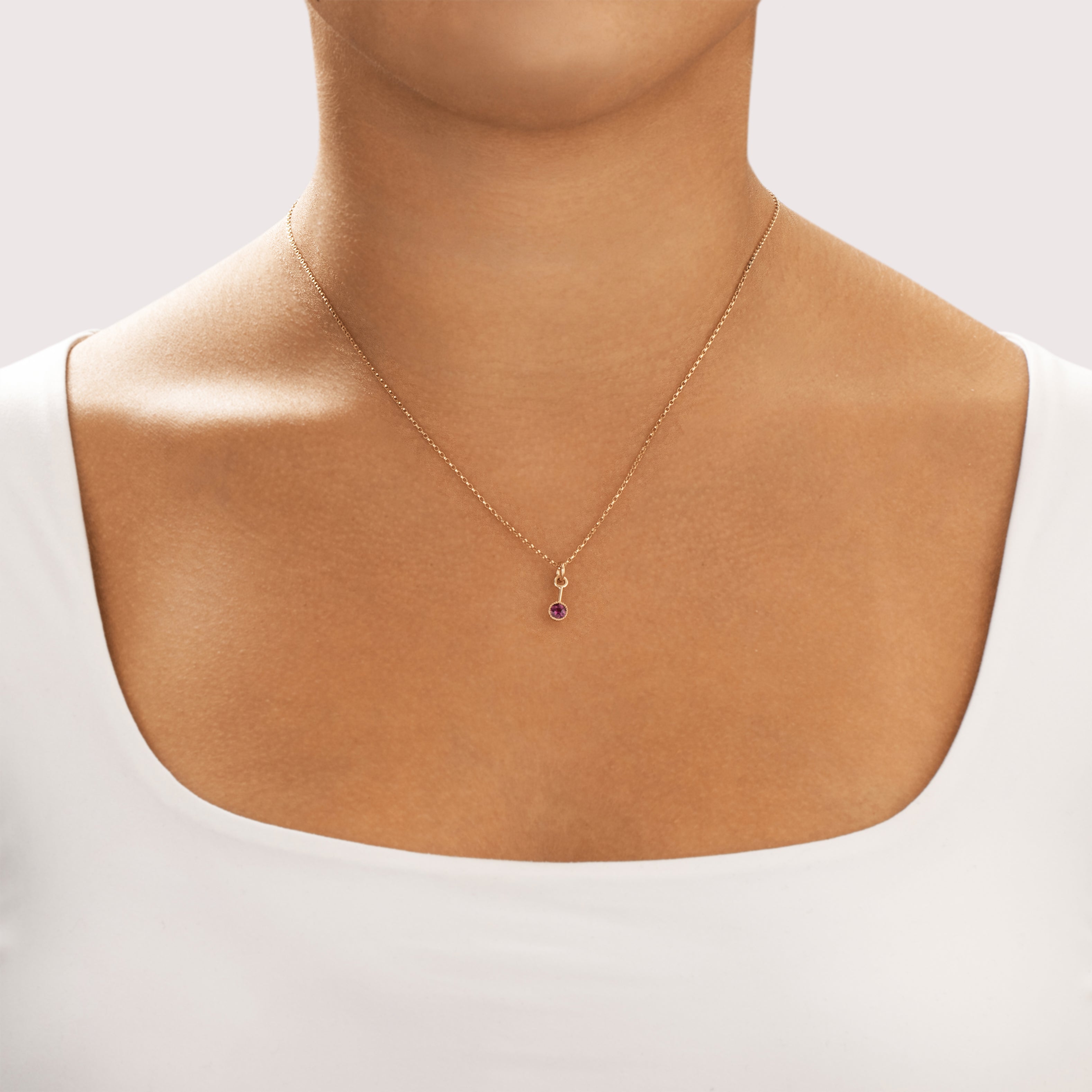 Antique 14k Yellow & Rosy Yellow Gold Dark Pink Garnet Dainty Drop Dangle Charm / Pendant - On model view