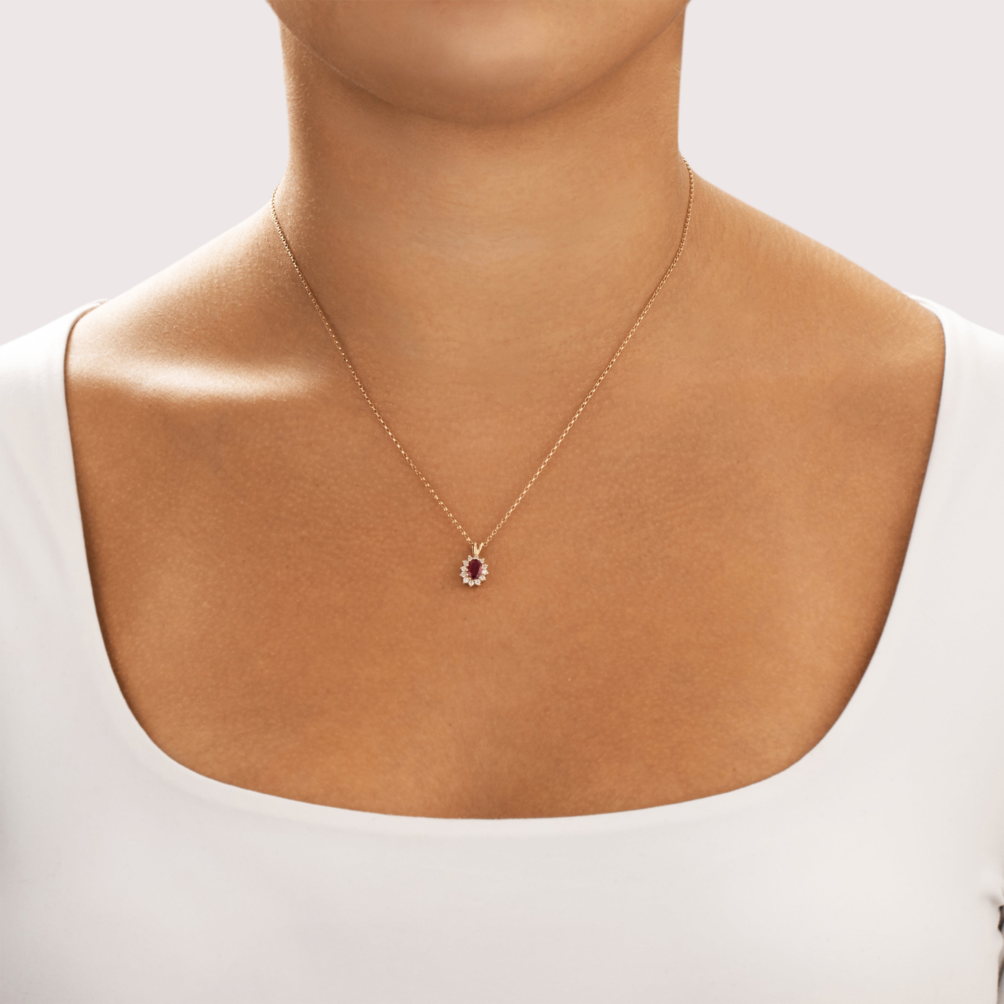 Vintage Small 10k Yellow Gold Ruby Diamond Classic Oval Halo Pendant - On model view