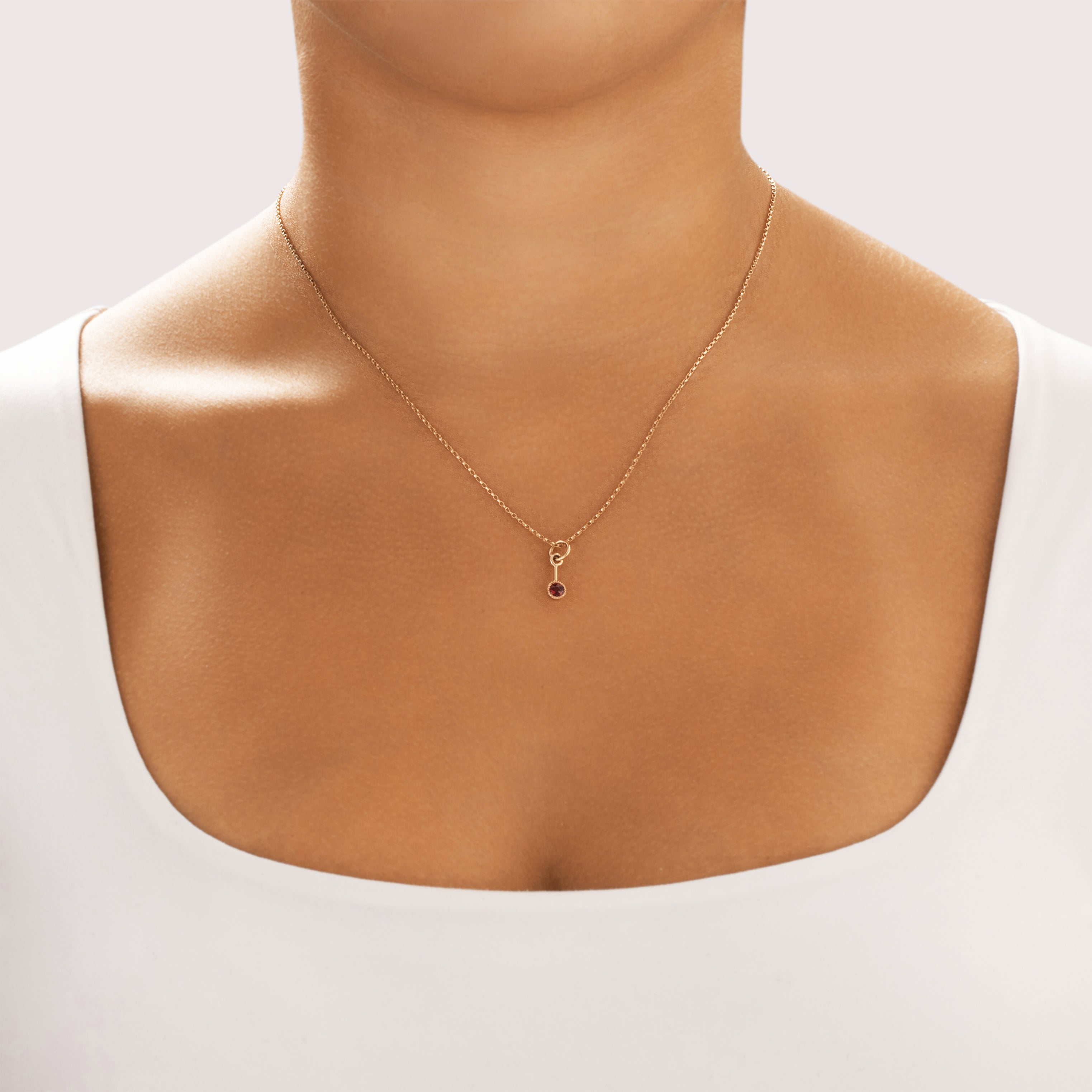 Antique Small 14k Rosy Yellow Gold Garnet Bezel Dangle Charm / Pendant - On model view