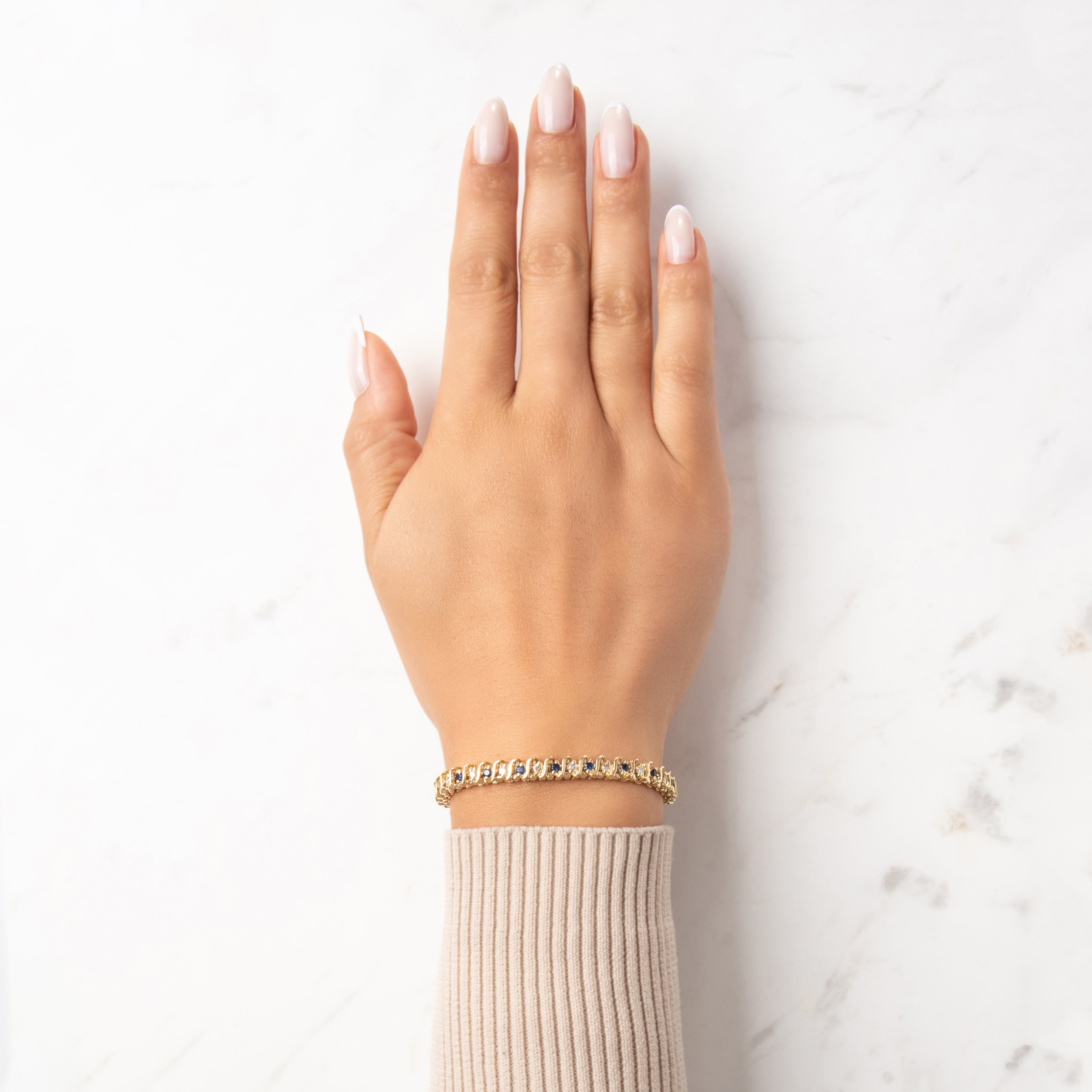 Vintage 14k Yellow Gold .91cttw Diamond .88cttw Blue Sapphire Classic Swoop Detail Alternating Bracelet - On model view