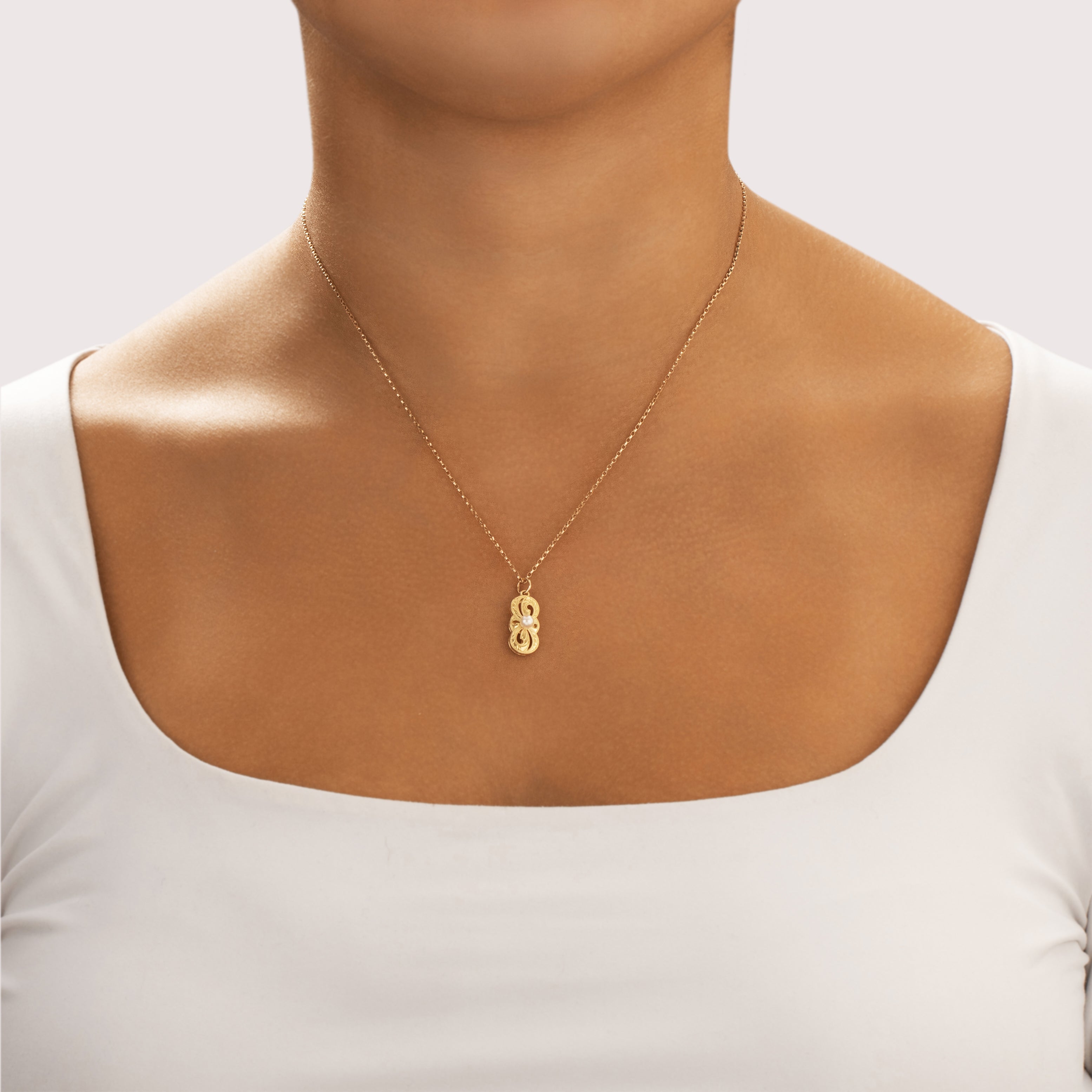 Vintage Mikimoto 18k Yellow Gold Pearl Infinite Engraved Swirl Pendant - On model view