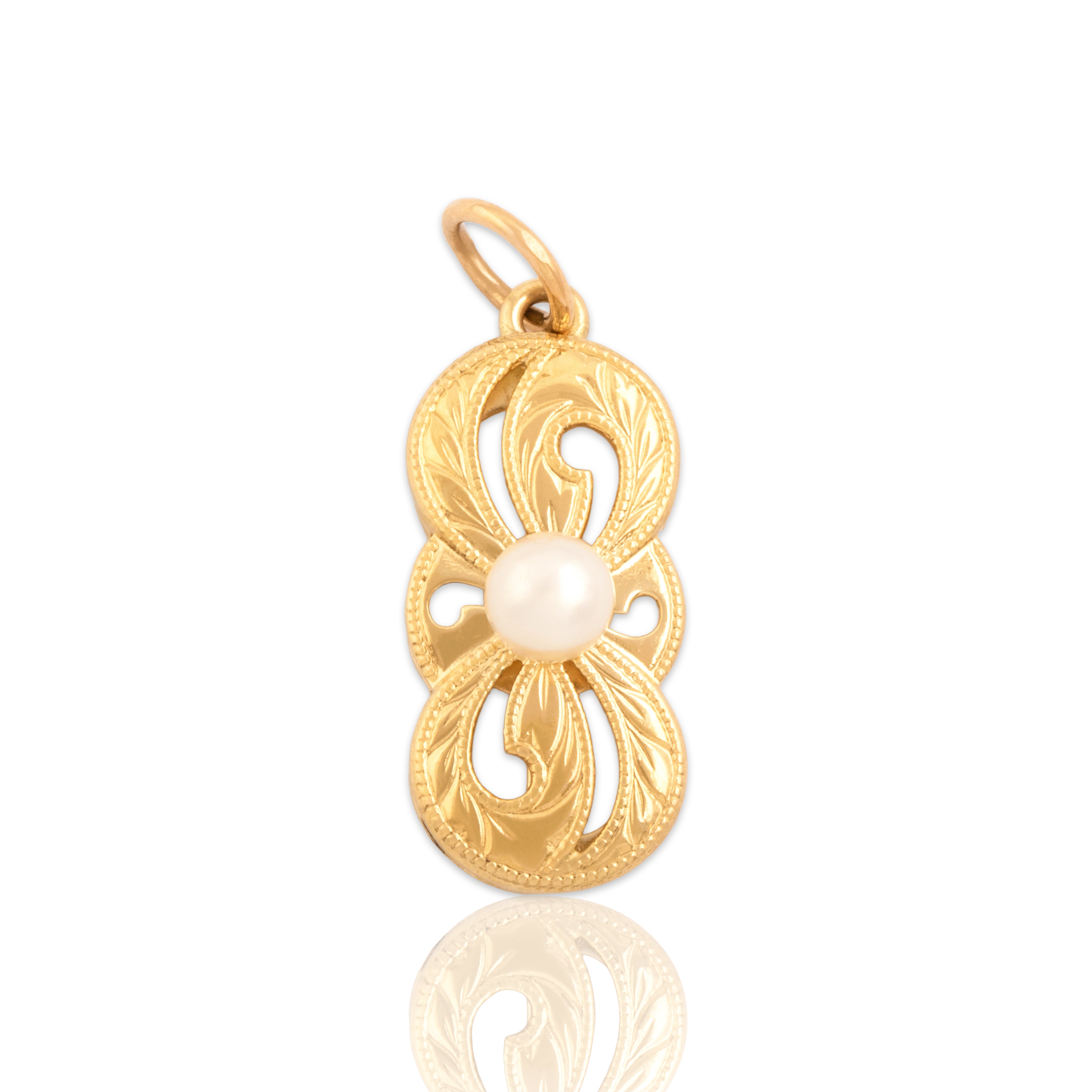 Vintage Mikimoto 18k Yellow Gold Pearl Infinite Engraved Swirl Pendant - Close-up view