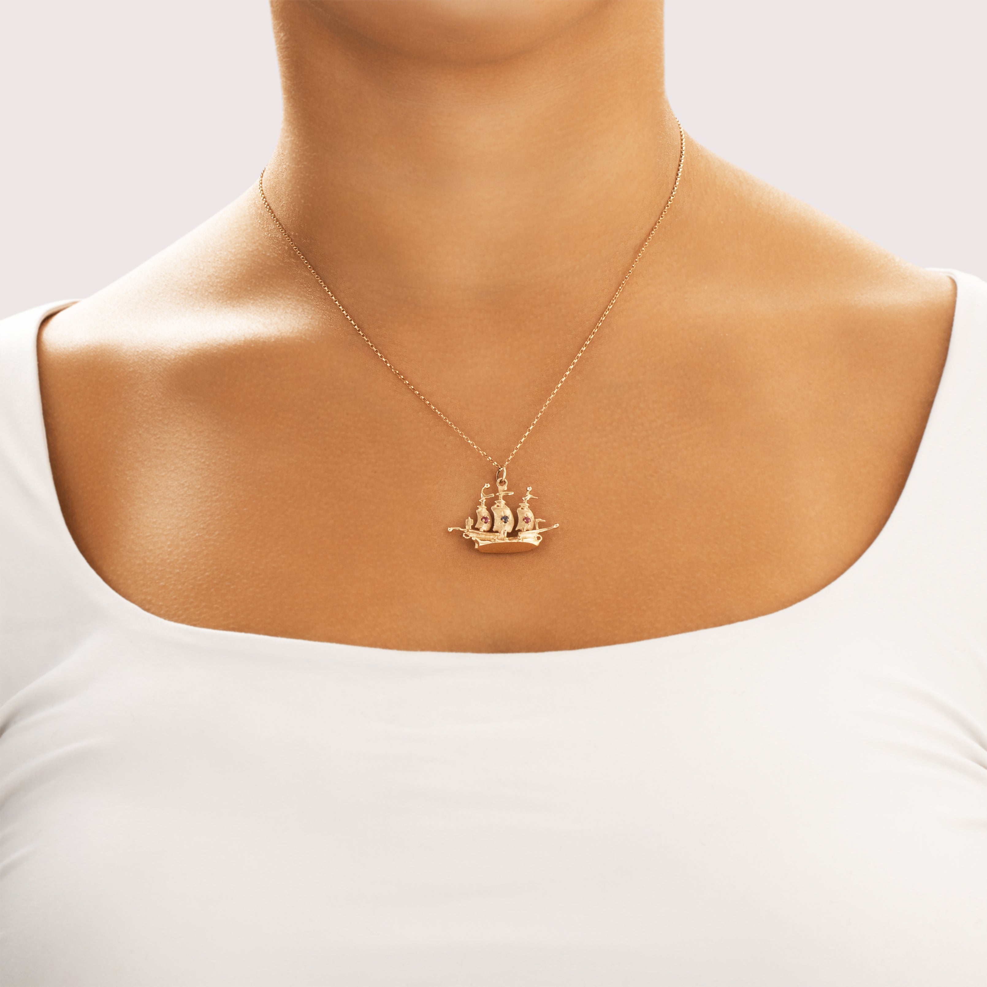 Vintage 10k Yellow Gold Ruby Blue Sapphire Sailing Pirate Ship Pendant - On model view