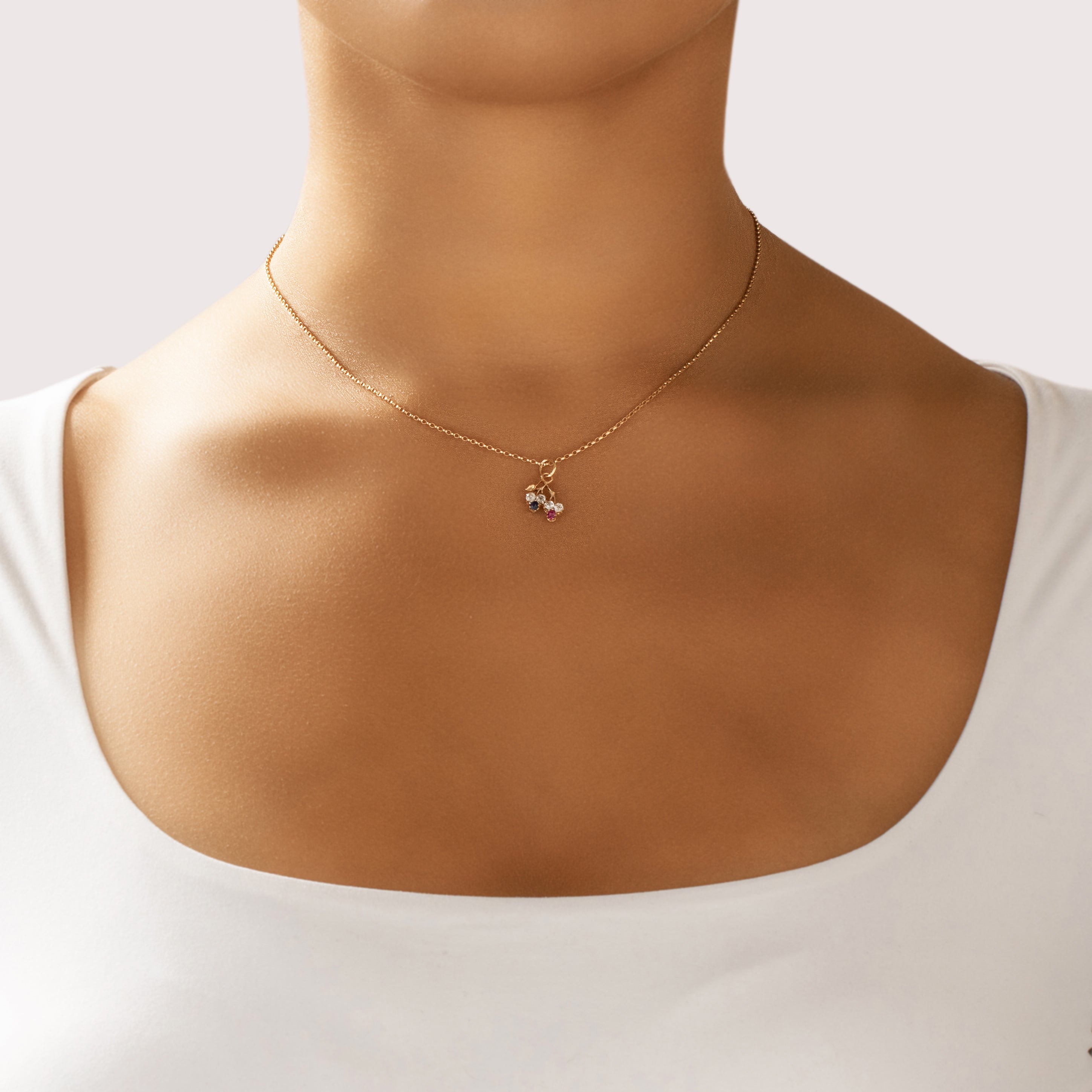 Antique Victorian Small 14k Rosy Yellow Gold Old Mine Cut Diamond Blue Natural Sapphire Synthetic Ruby Twin Clover Charm / Pendant - On model view