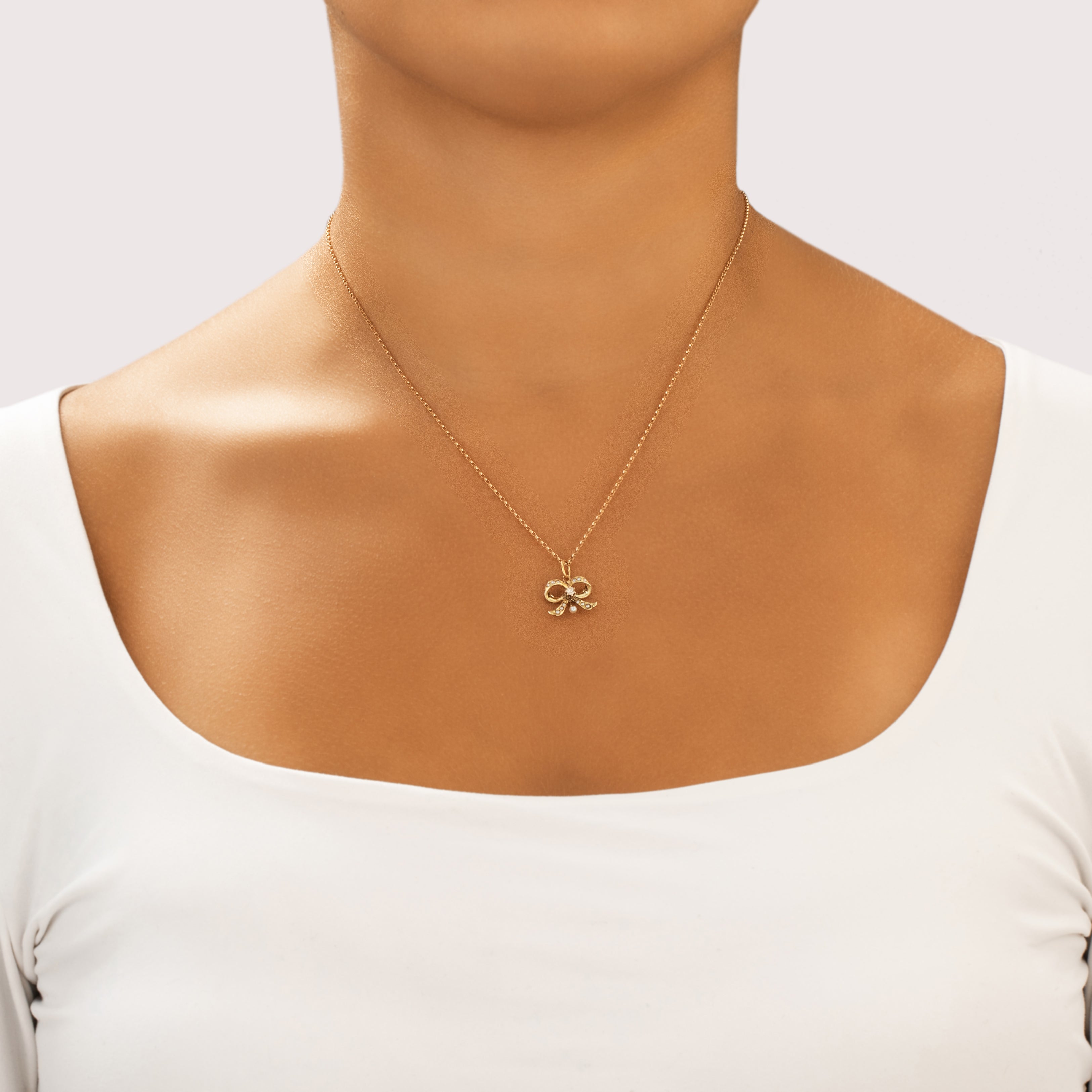 Antique Victorian 14k Yellow Gold Old Mine Cut Diamond Pearl Beautiful Adorned Bow Charm / Pendant - On model view