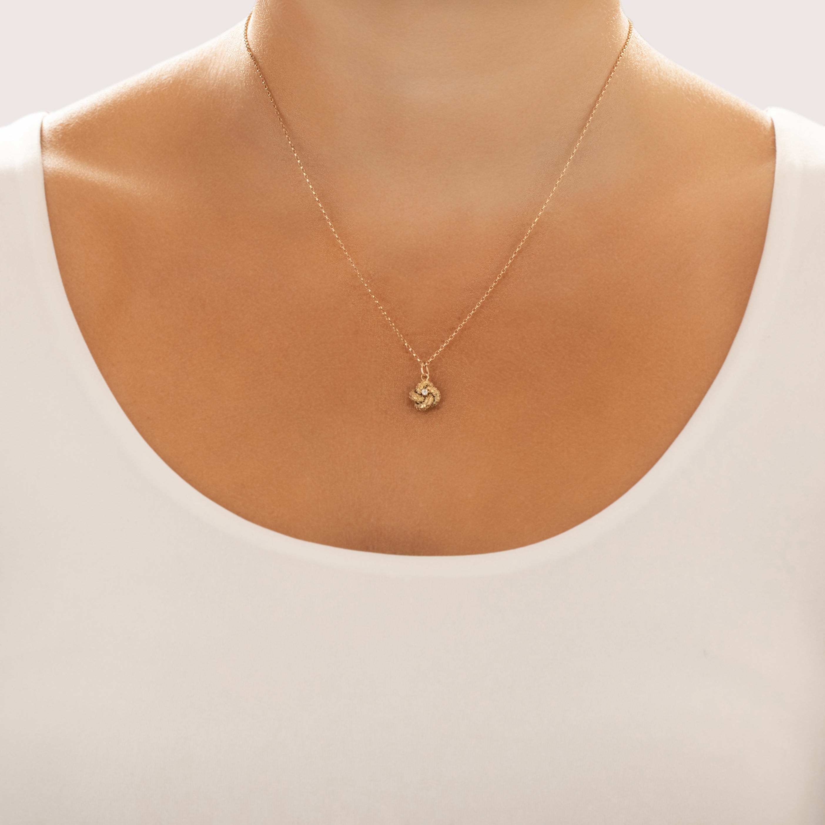 Antique Victorian 14k Yellow & Rosy Yellow Gold Old Mine Cut Diamond Textured Lover's Knot Charm / Pendant - On model view