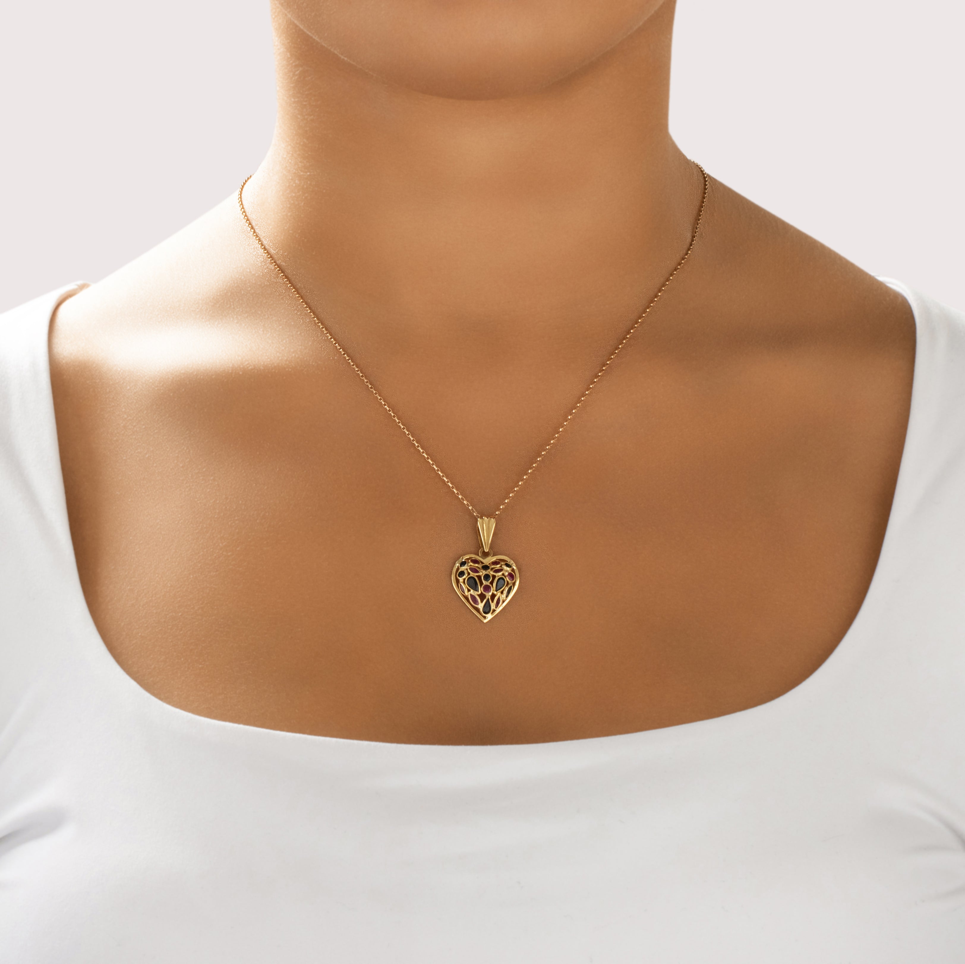Vintage Italian 18k Yellow Gold .86cttw Dark Blue Sapphire .54cttw Ruby Fantastic Cluster Heart Pendant - On model view