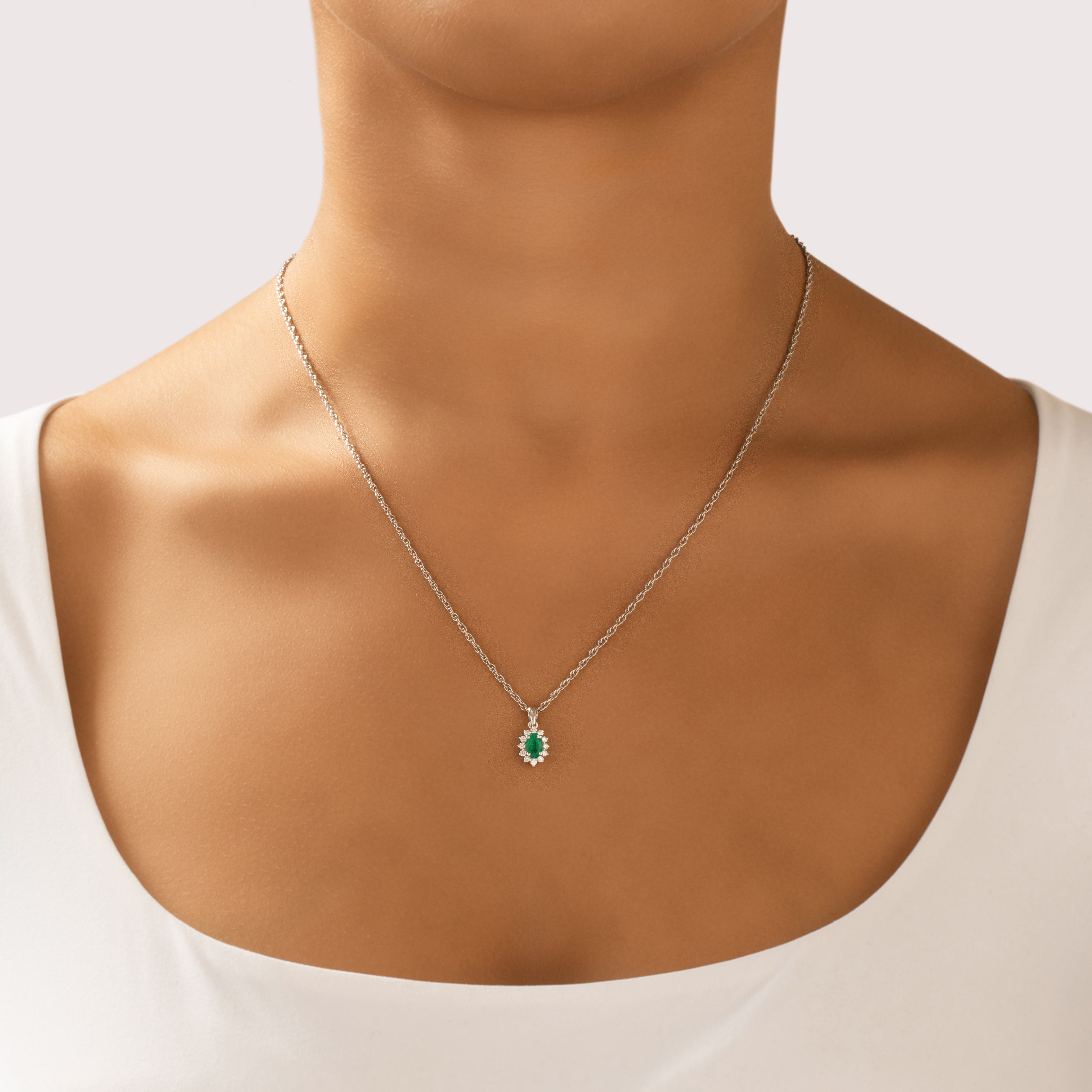Vintage Small 14k White Gold Emerald Diamond Refined Oval Halo Pendant - On model view