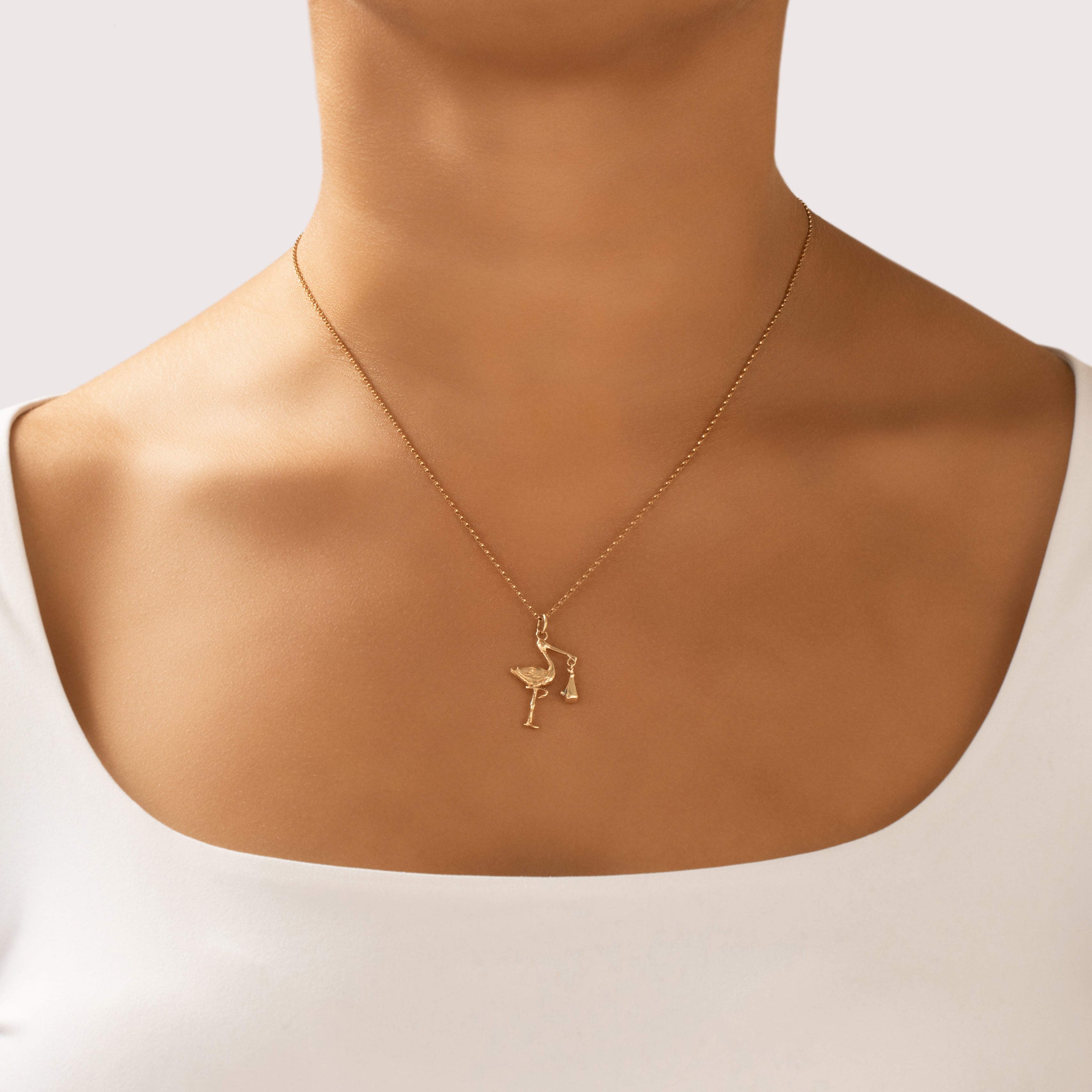 Vintage 14k Yellow Gold Articulated Stork Blue Enamel Baby Charm / Pendant - On model view