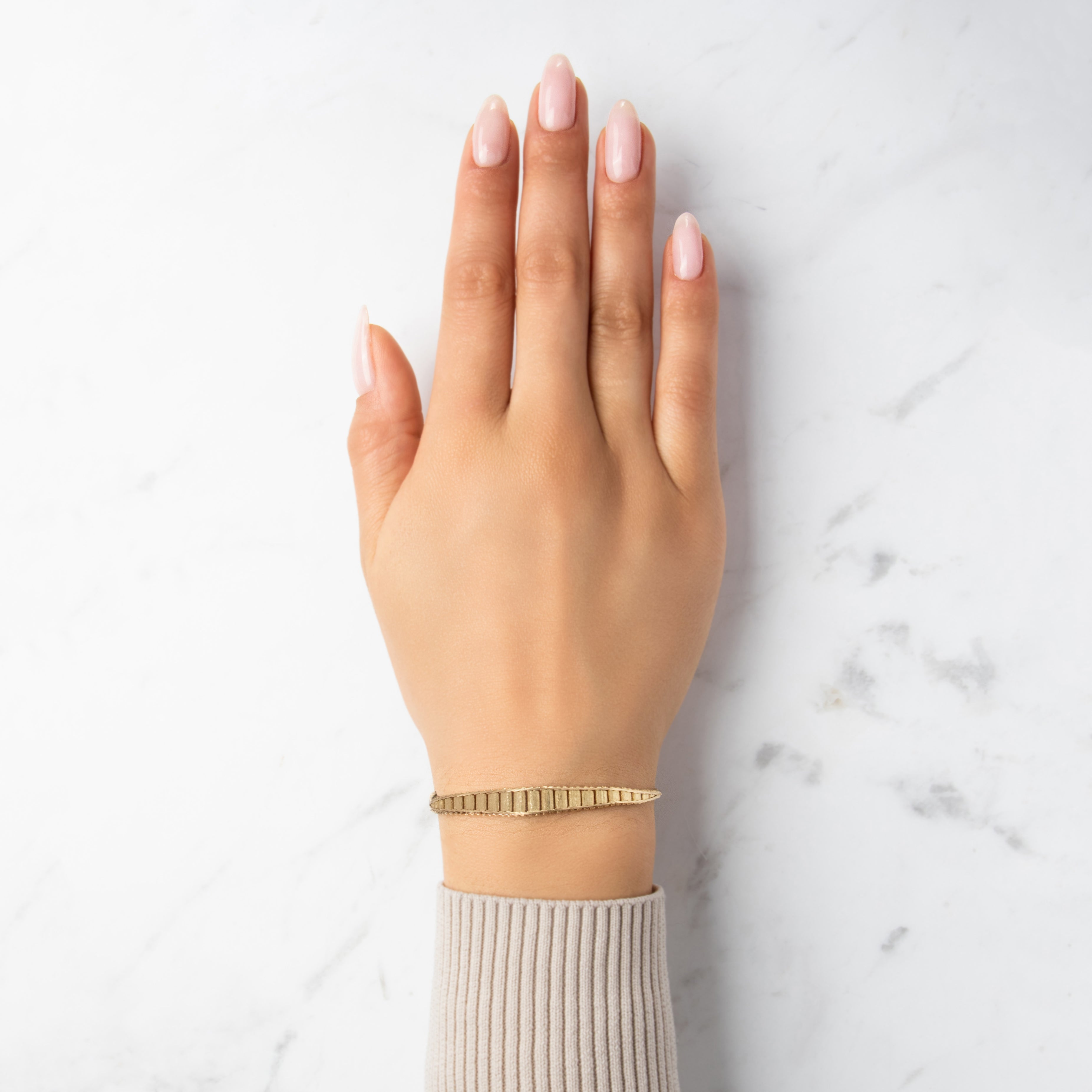 Vintage Italian 14k Yellow Gold Textured Graduated Herringbone Link Bracelet - On model view