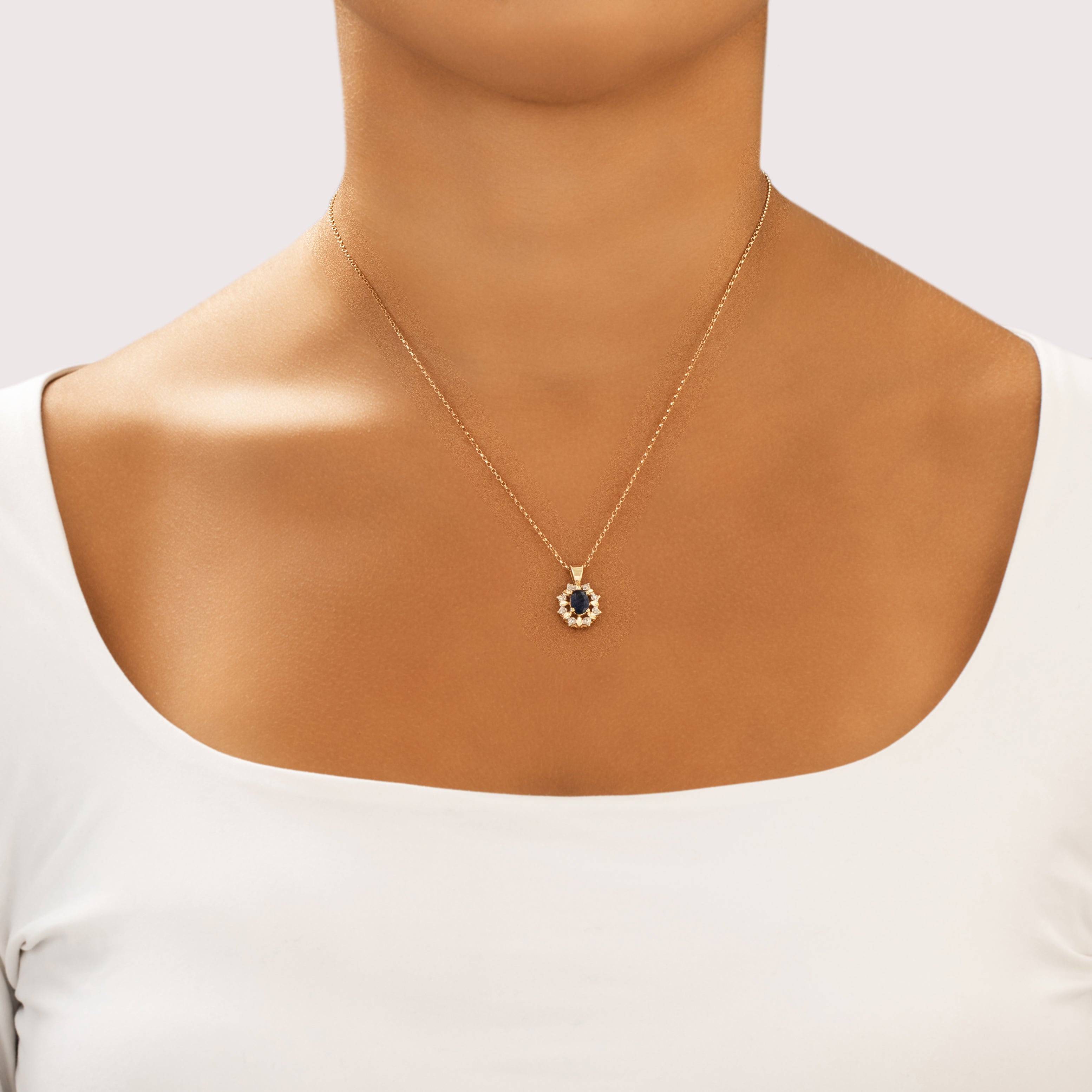 Vintage Small 14k Yellow Gold .68ct Blue Sapphire Diamond Burst Halo Pendant - On model view