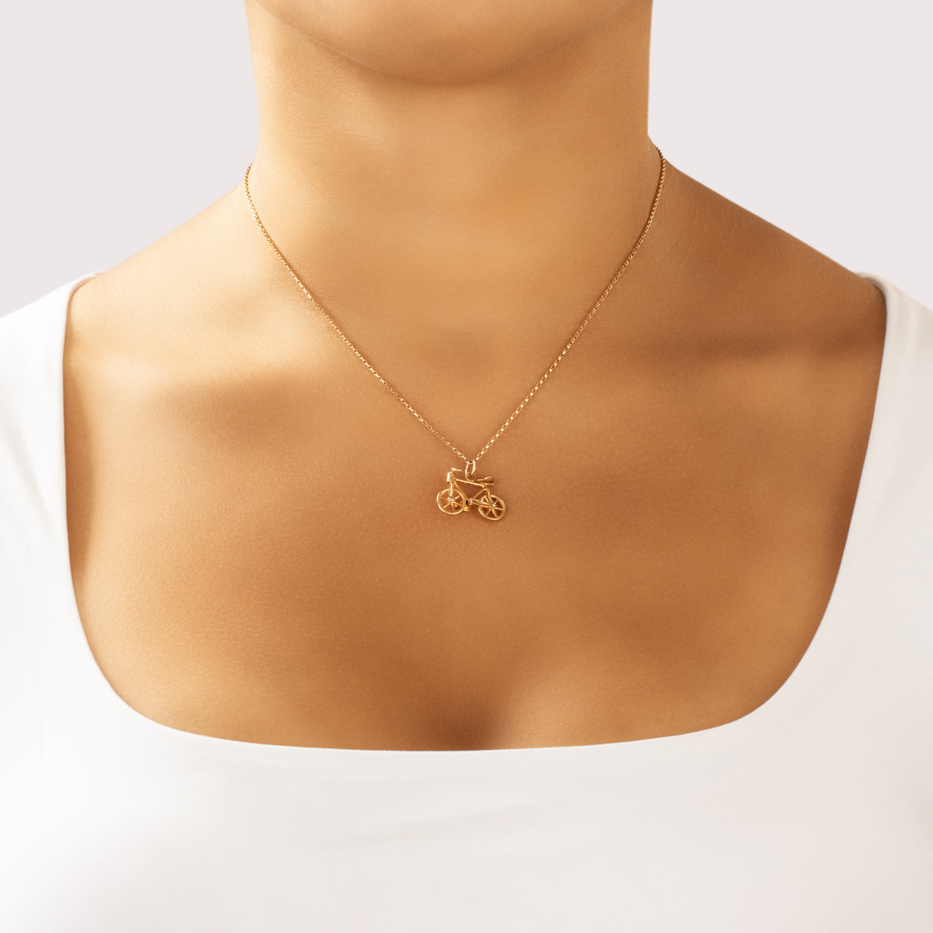 Vintage 14k Yellow Gold Speedy Articulated Bicycle Charm / Pendant - On model view