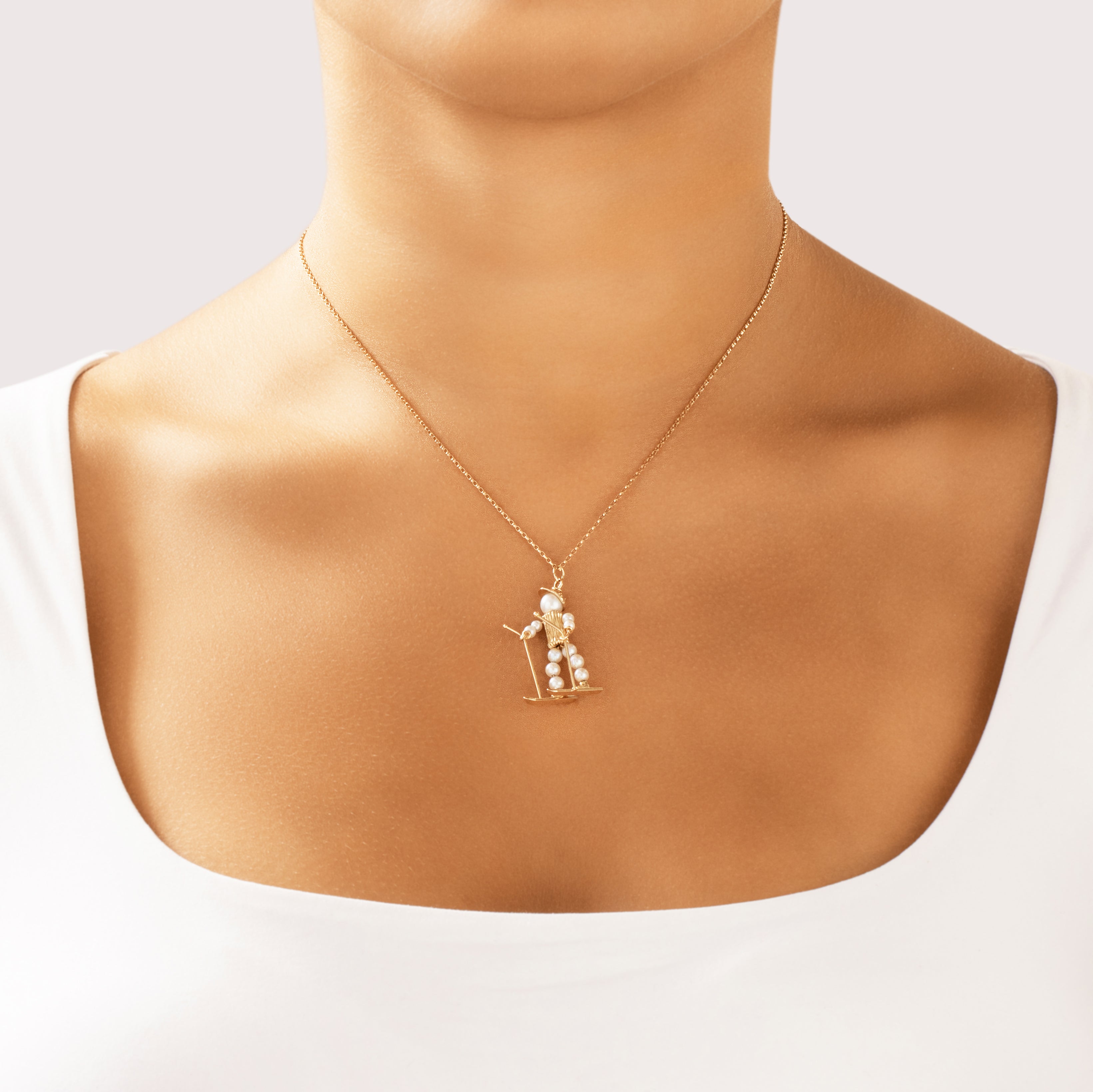 Vintage 14k Yellow Gold Pearl Delightful Sporty Skier Pendant - On model view