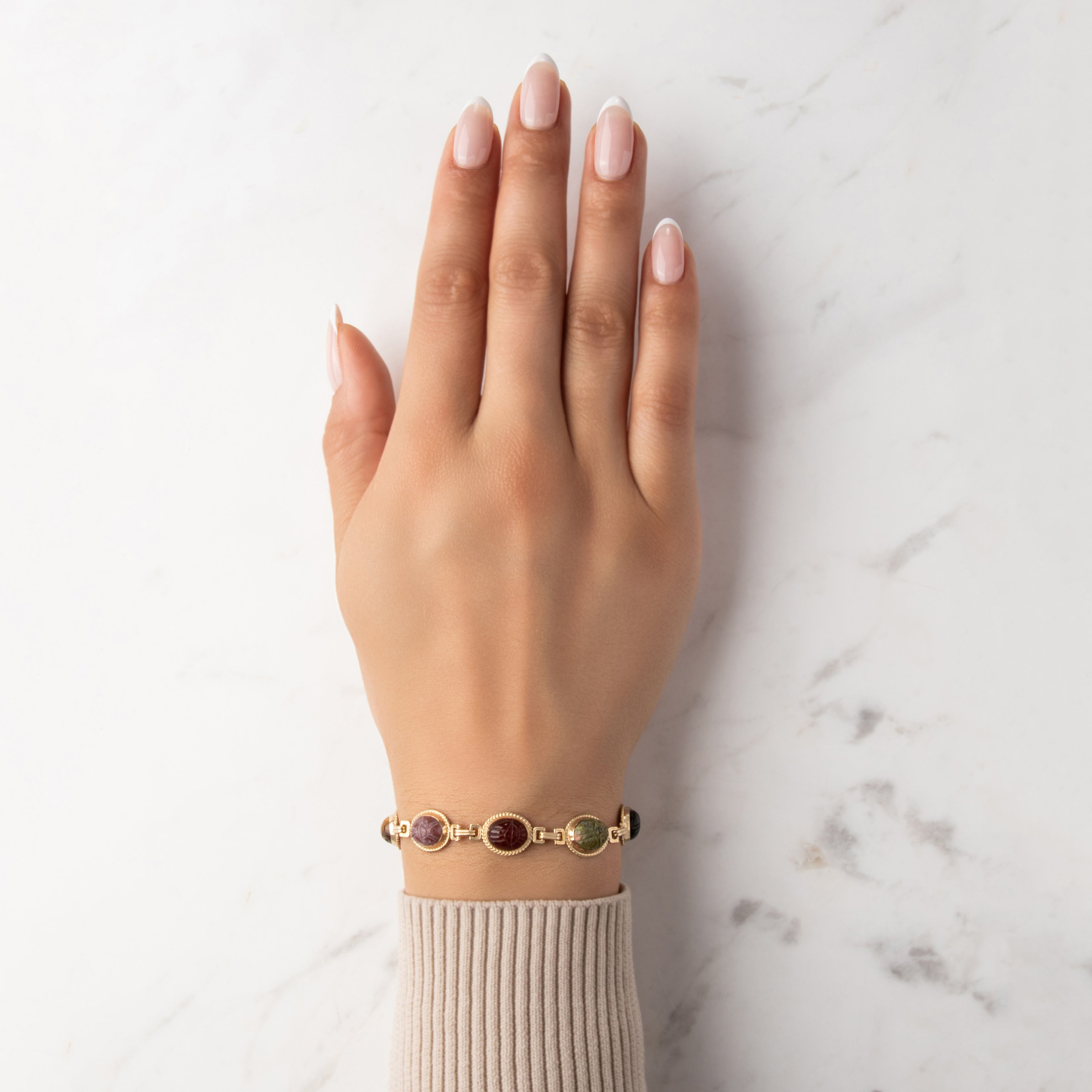 Vintage 14k Yellow Gold 4.69cttw Carnelian 4.58cttw Green Blue Chalcedony 2.99ct Rhodonite 2.59ct Unakite 2.42ct Tiger's Eye 2.18ct Onyx Carved Scarab Cabochon Link Bracelet - On model view
