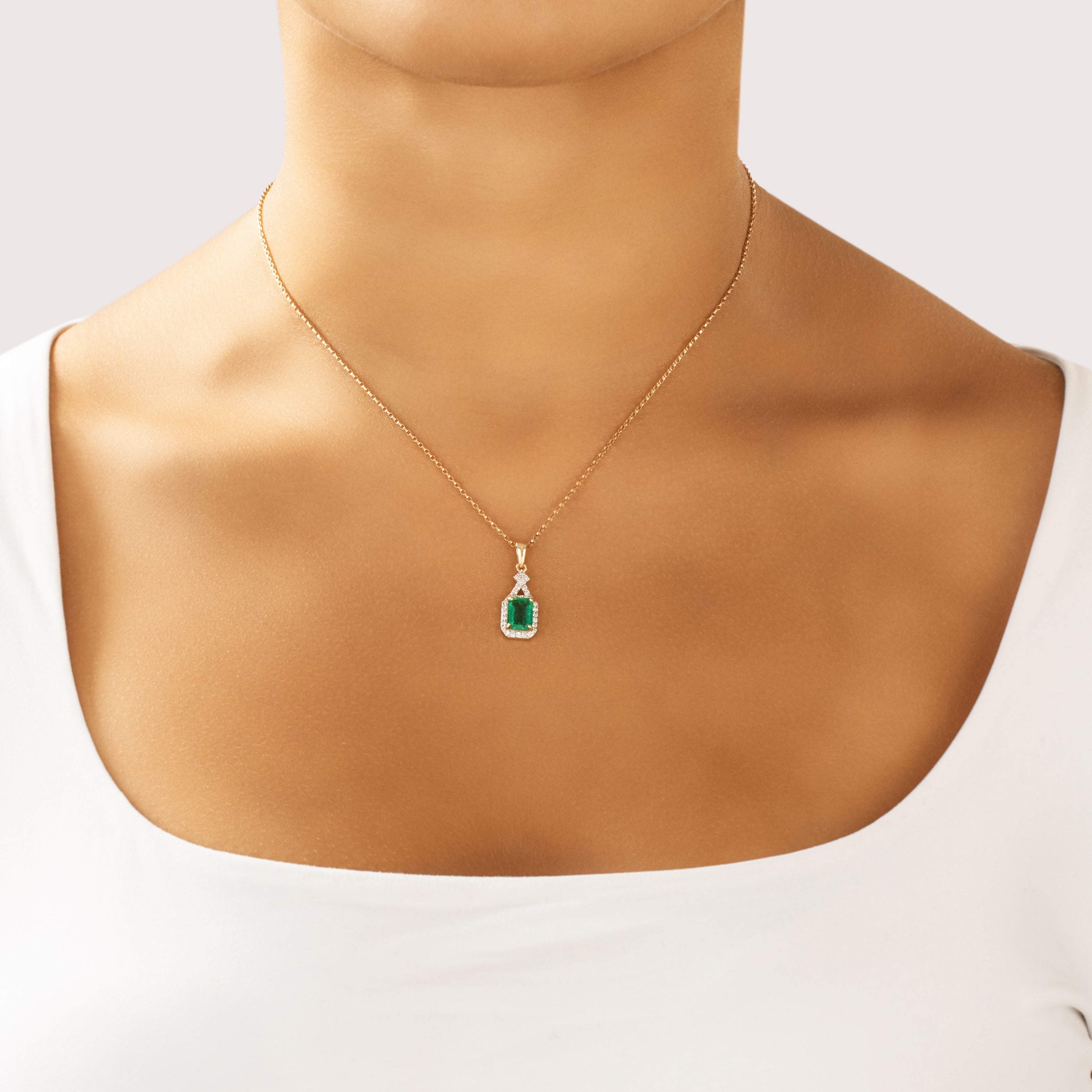 Vintage 14k Yellow Gold 1.16ct Emerald Diamond Elegant Halo Dangle Pendant - On model view