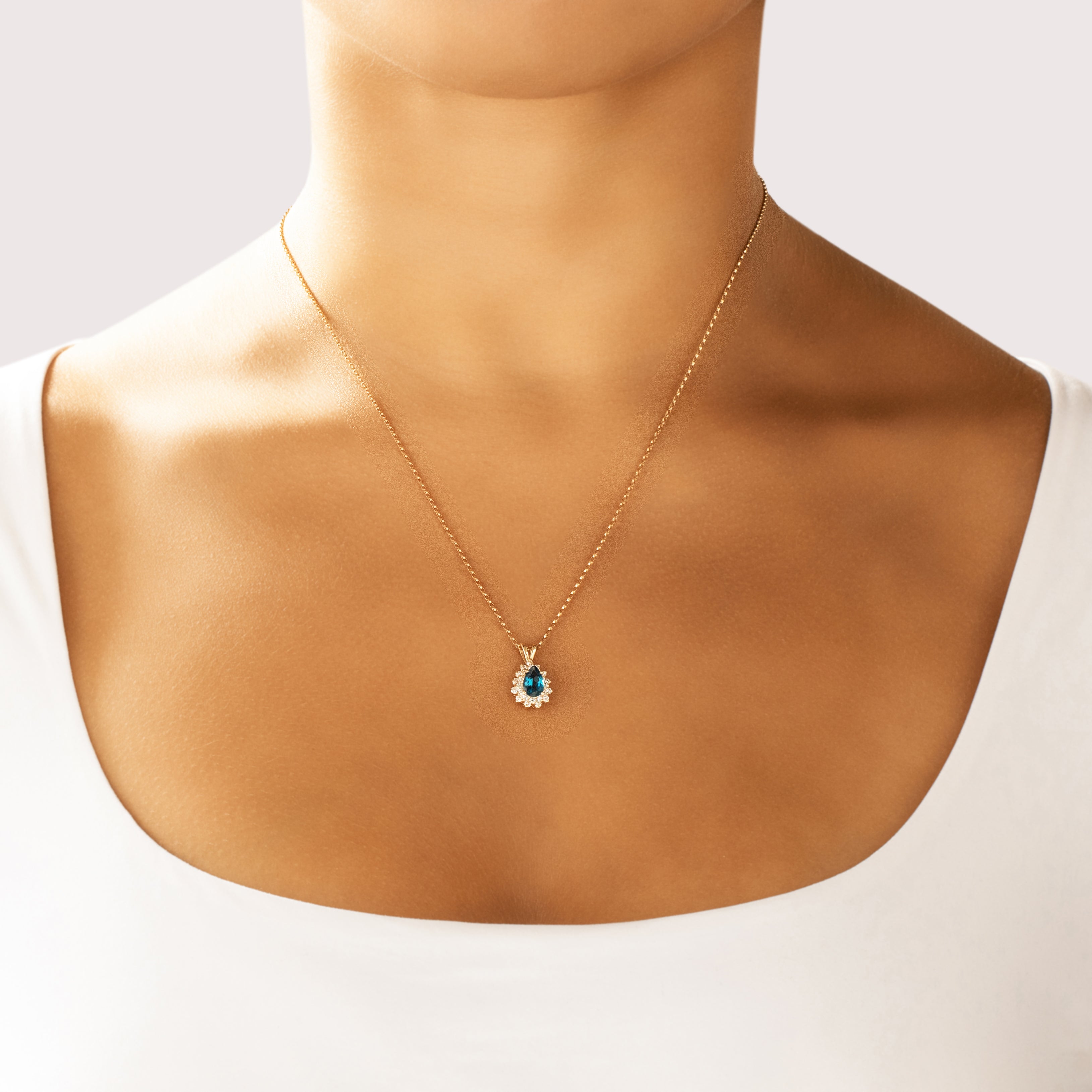 Vintage 14k Yellow Gold .9ct London Blue Topaz Diamond Glittering Oceanic Halo Pendant - On model view