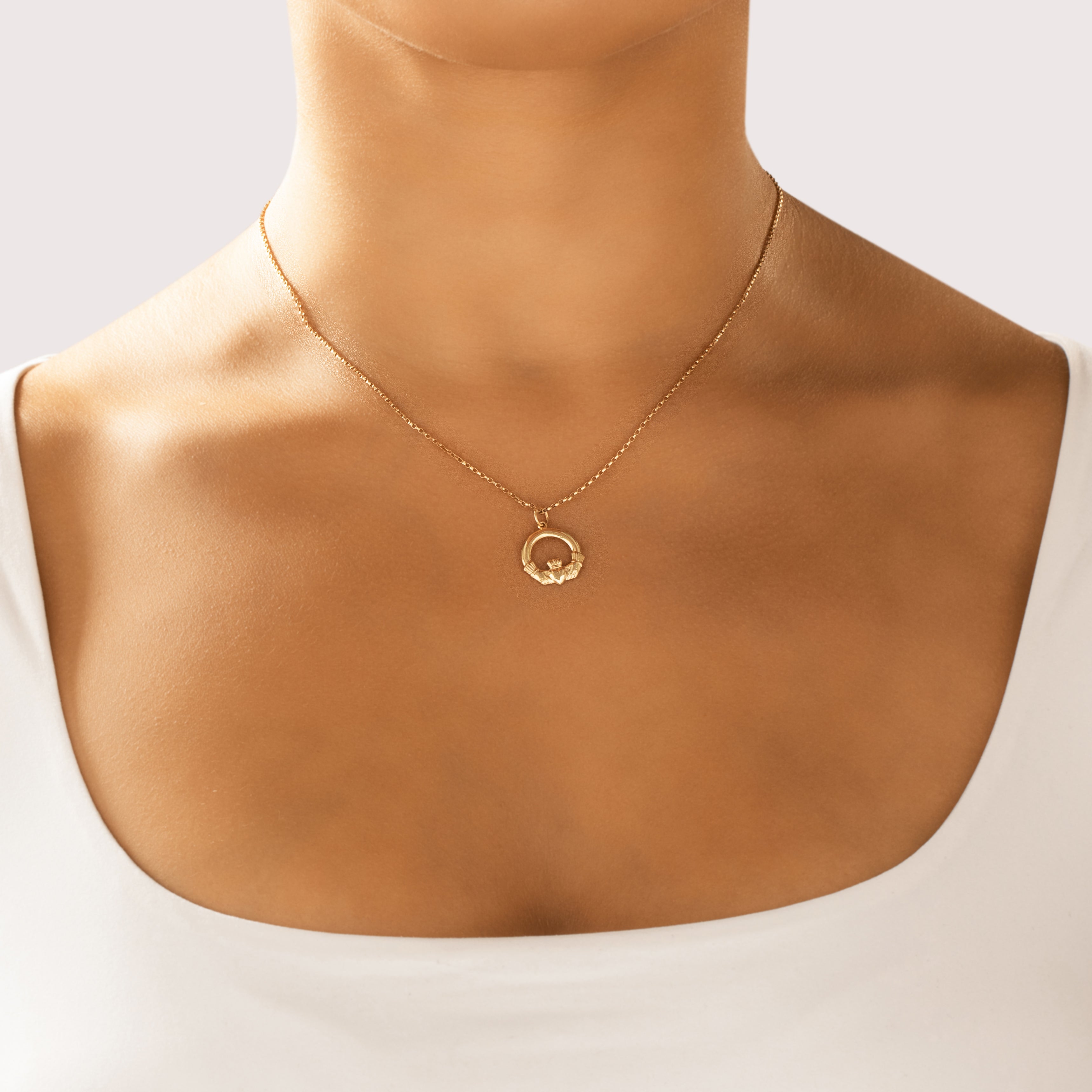Vintage Irish Lightweight 10k Yellow Gold Gleaming Claddagh Charm / Pendant - On model view