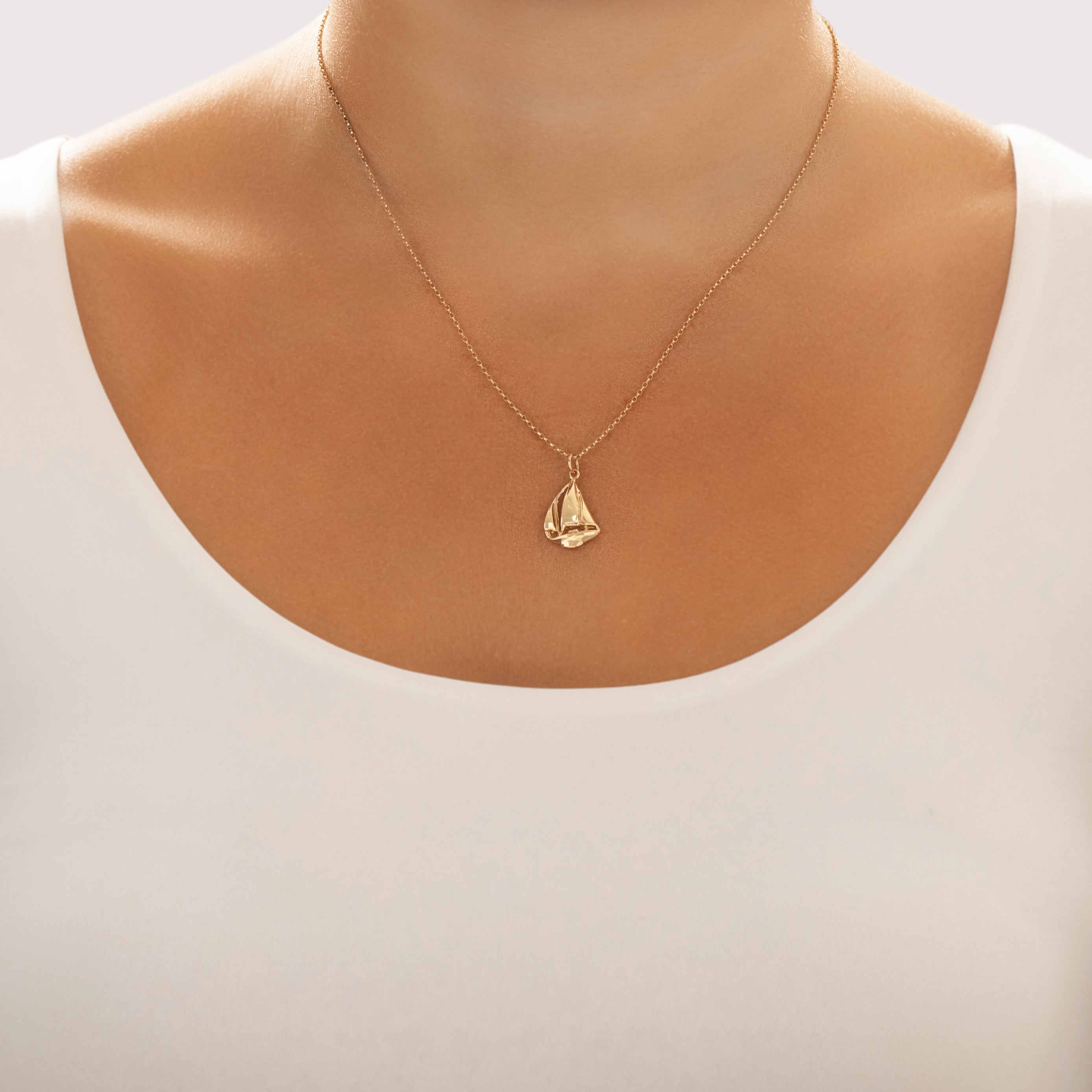 Vintage 14k Yellow Gold Gliding Sail Boat Charm / Pendant - On model view