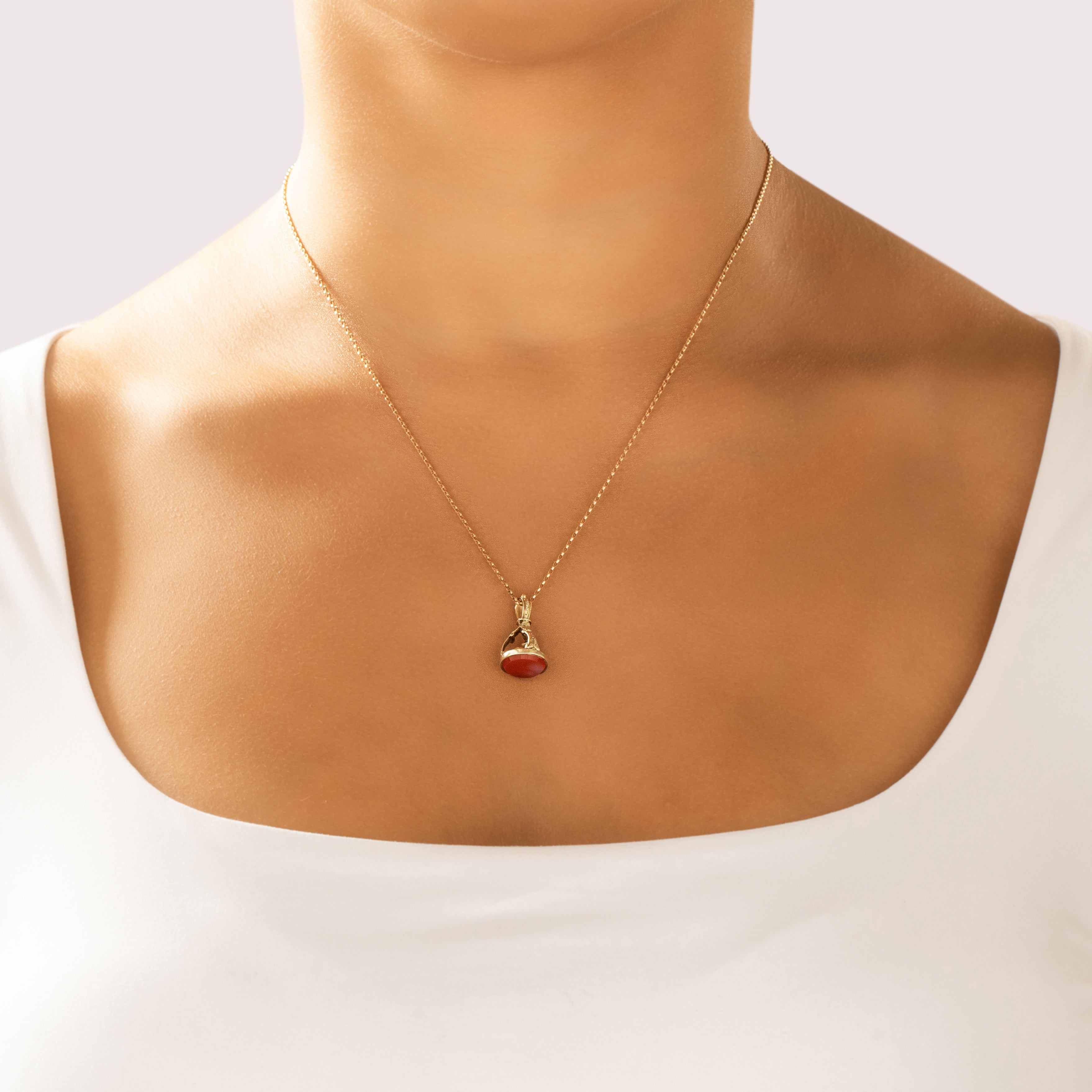 Antique 14k Yellow Gold 3.41ct Carnelian Ornate Crowned Watch Fob Pendant - On model view