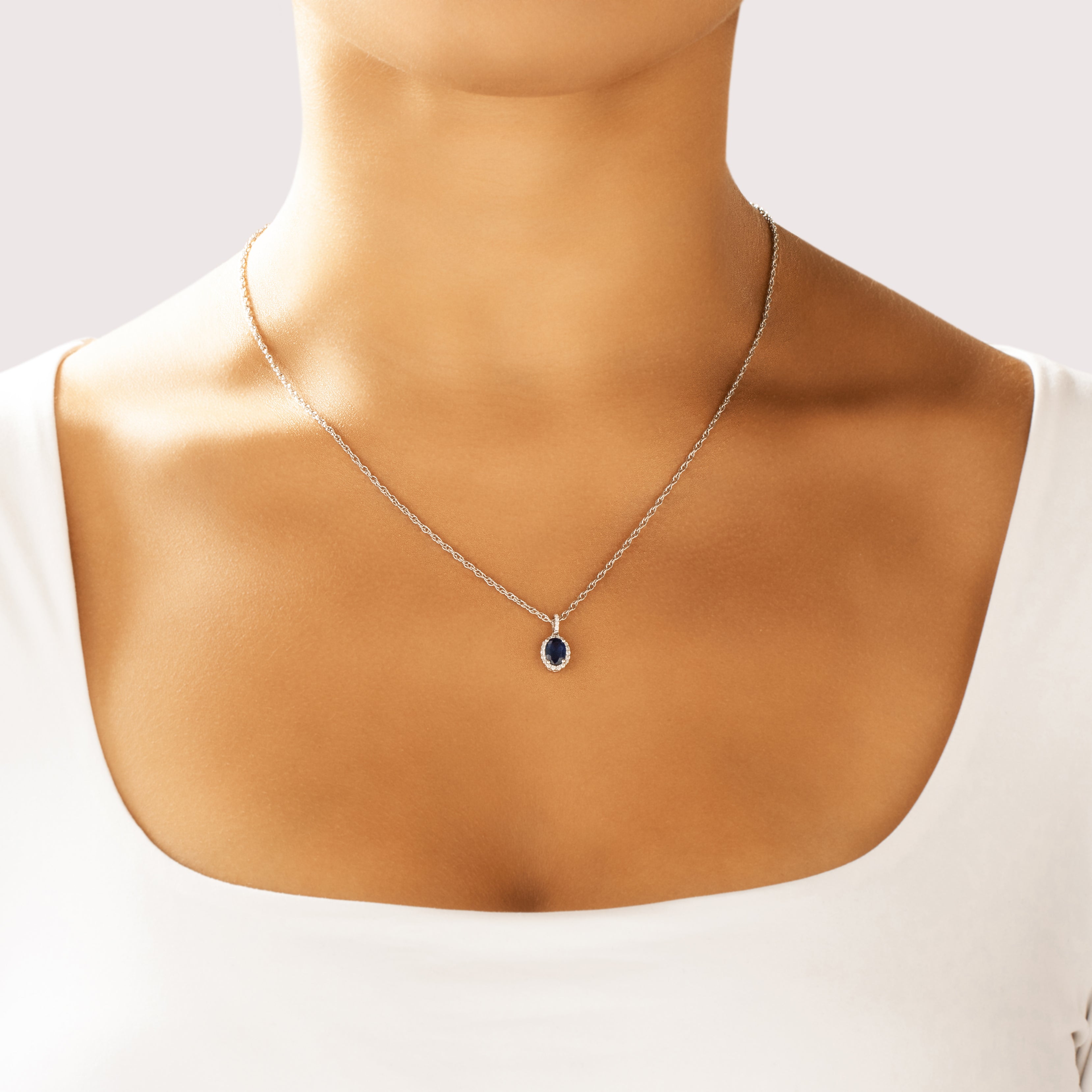 Vintage Small 14k White Gold 1.03ct Sapphire Diamond Dazzling Oval Halo Pendant - On model view