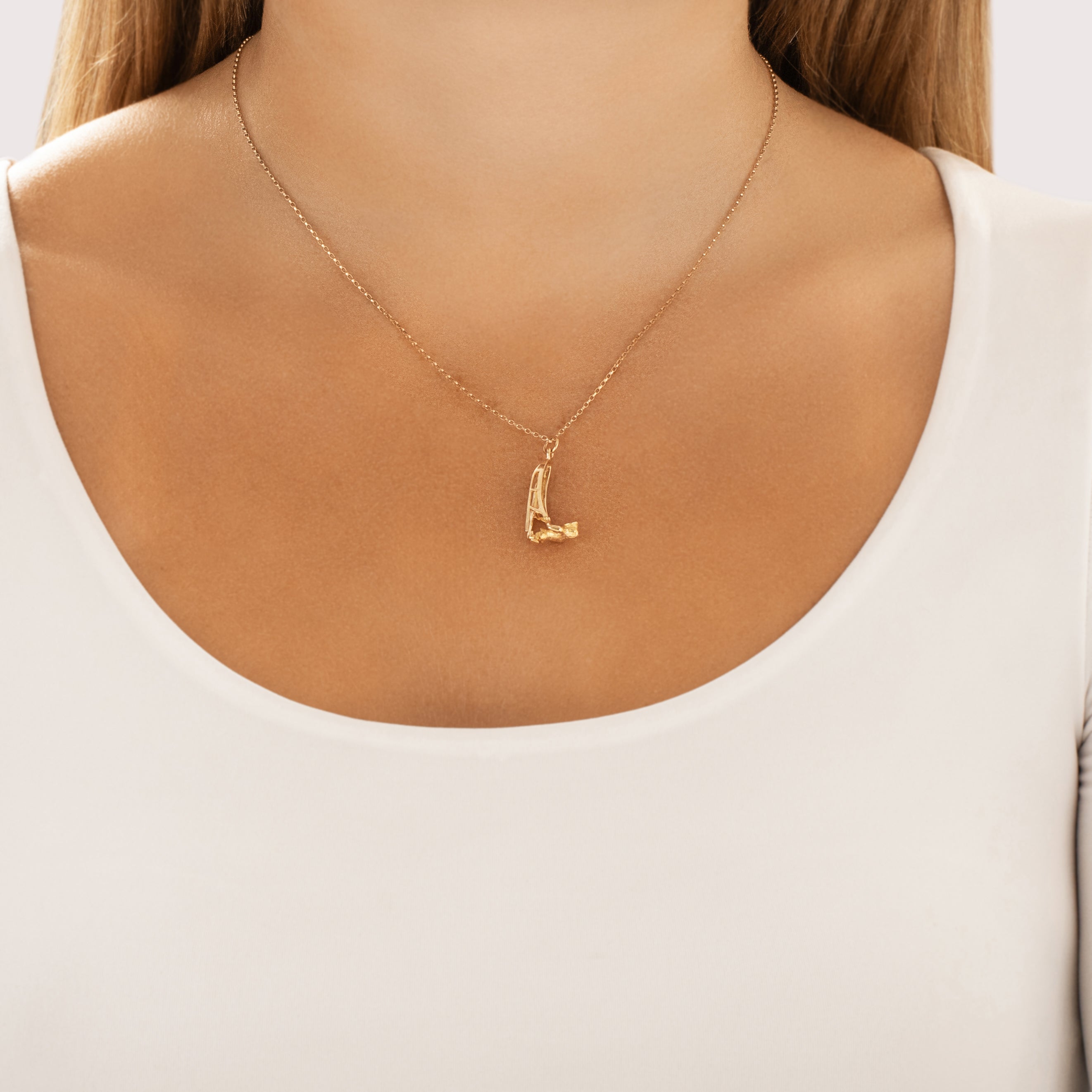 Vintage 10k Yellow Gold Inuit Sledder Charm / Pendant - On model view